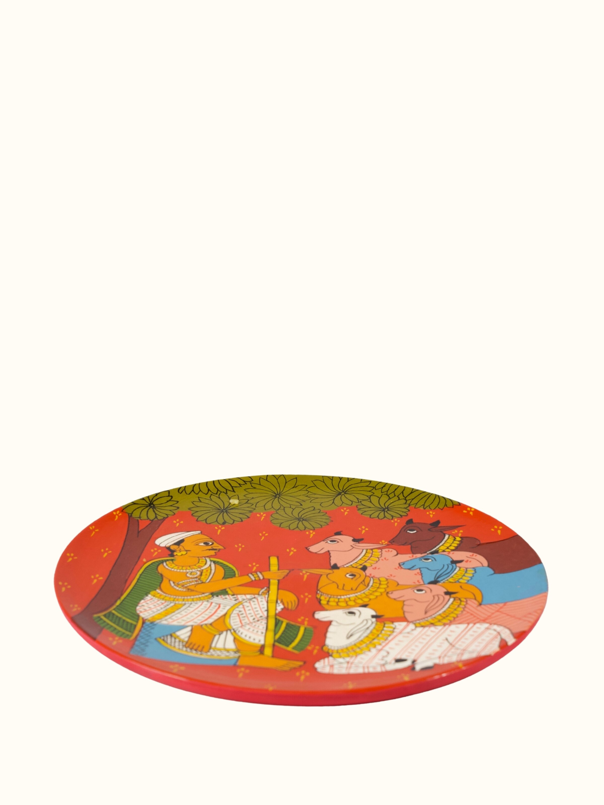 Angled view of Cheriyal Cow Handpainted Display Plate