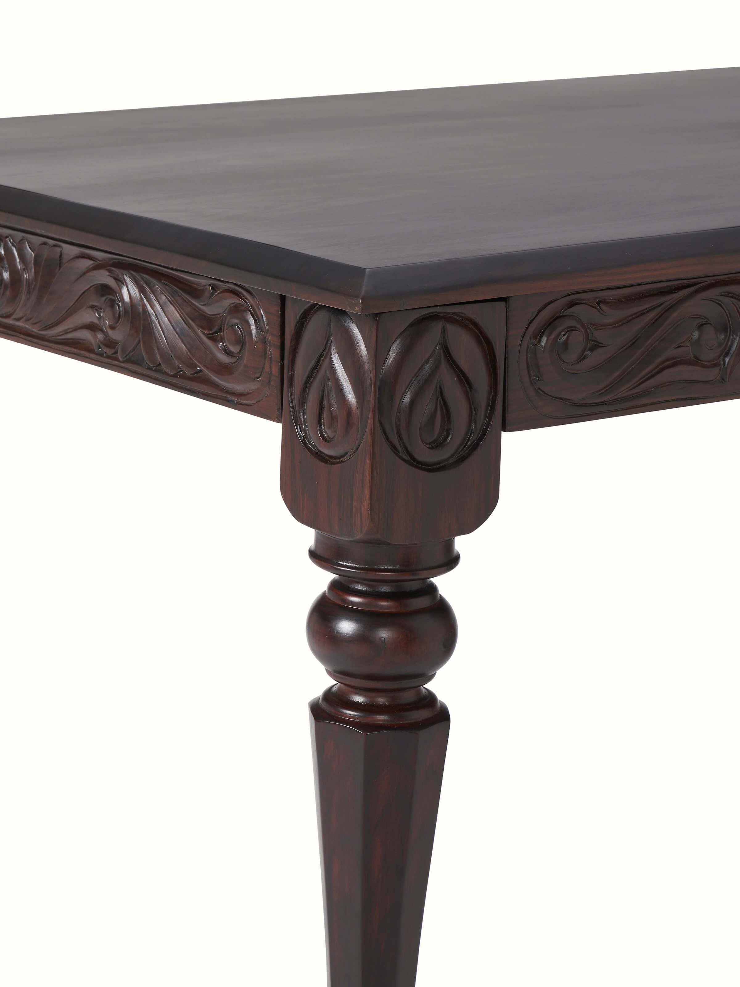 Angle view of carved rosewood 6-seater dining table, showcasing its overall design and craftsmanship