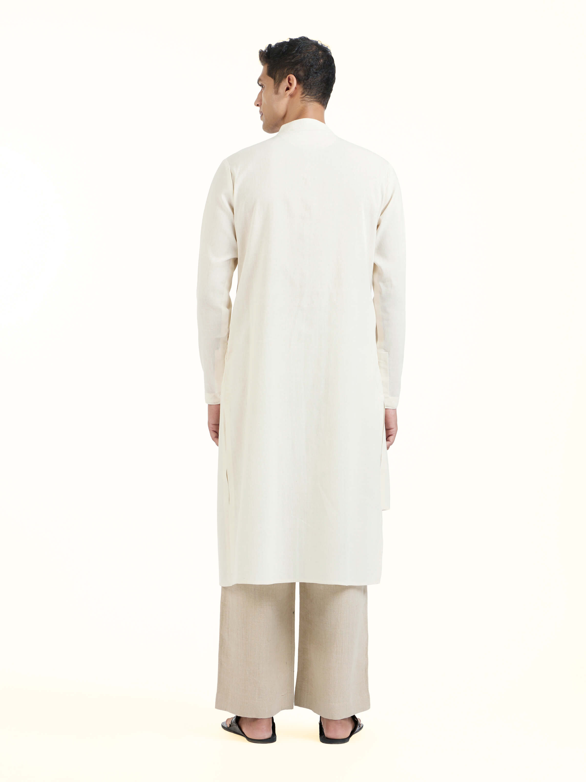 Back view of peach silk handloom long kurta displaying overall design