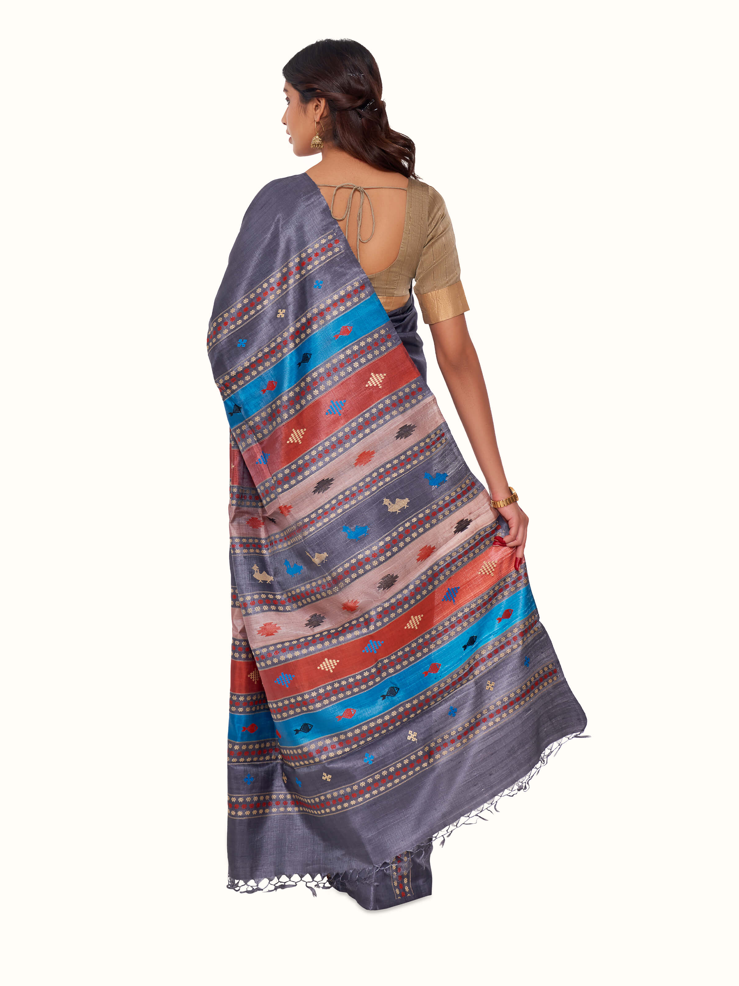 Back view of black tussar silk extra-weft saree displaying detailed pallu design