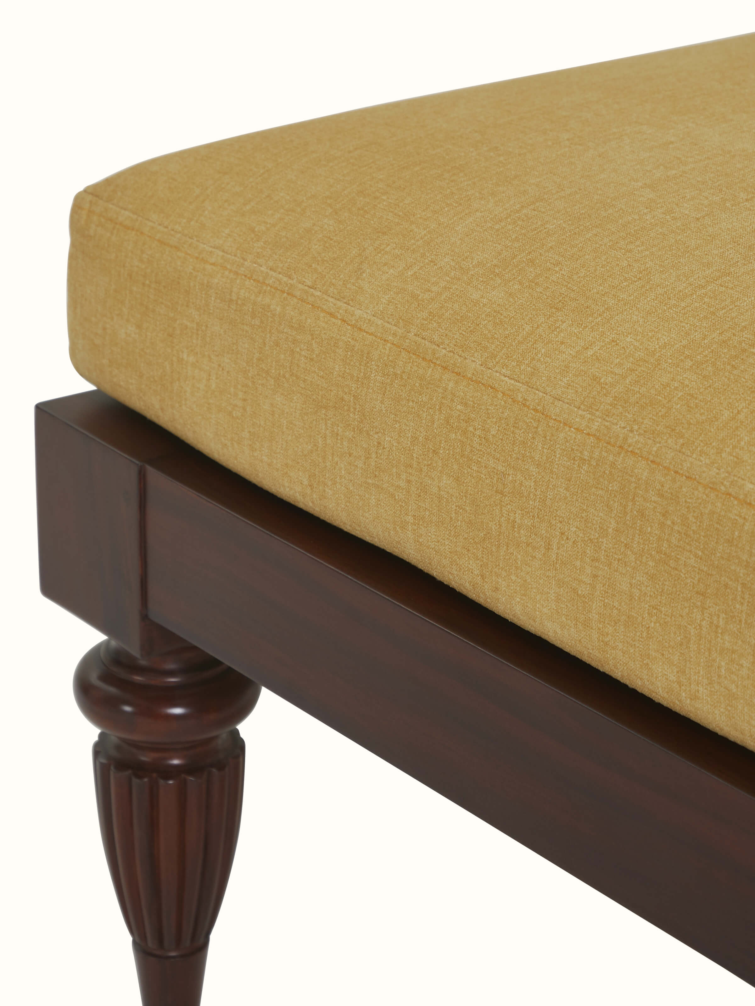 Detailed side view of Upholstered Mahogany Wood Ottoman by Swadesh showcasing its sturdy legs and smooth finish.