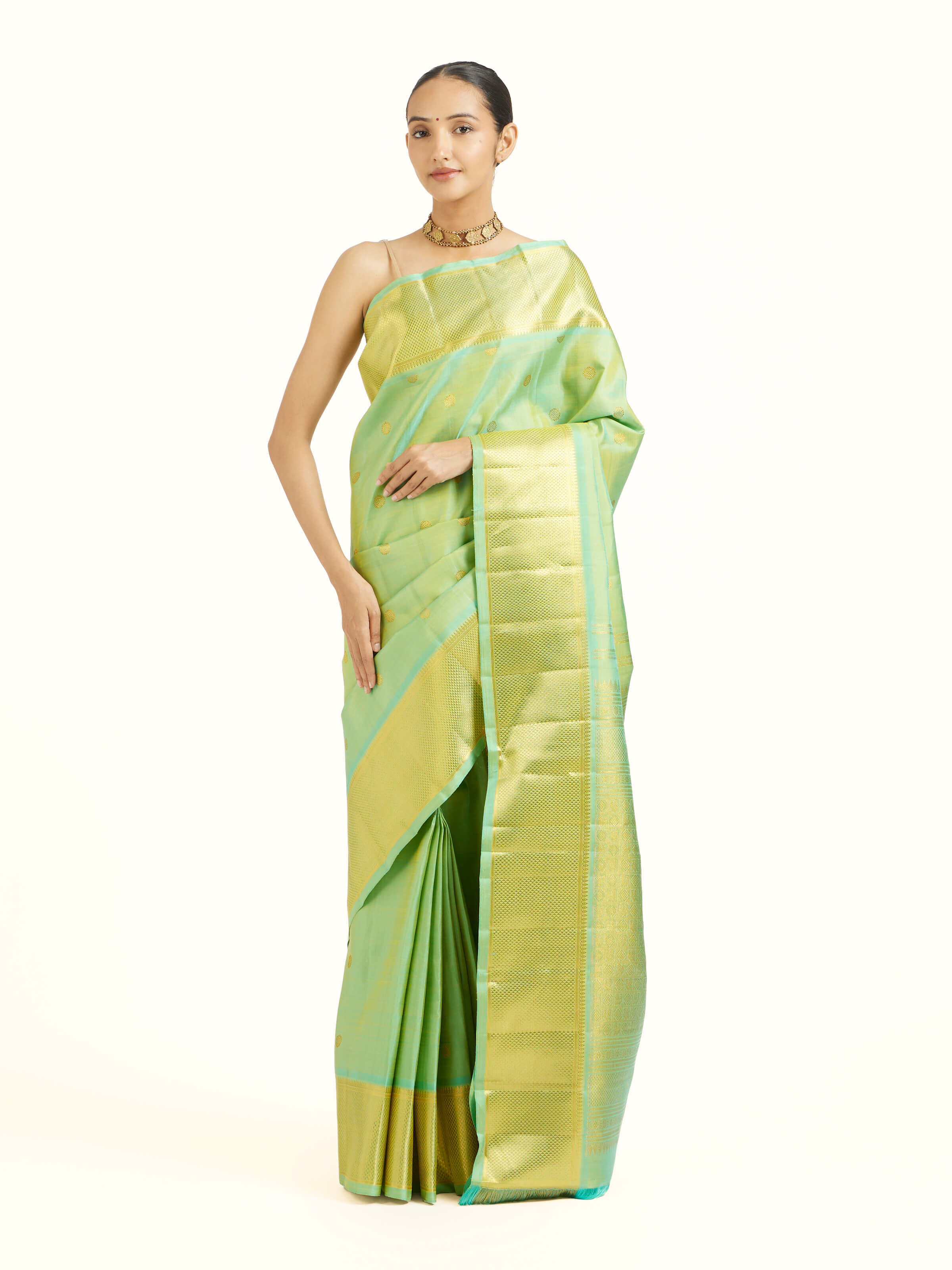 Front view of green silk Kancheepuram saree with rich zari woven motifs
