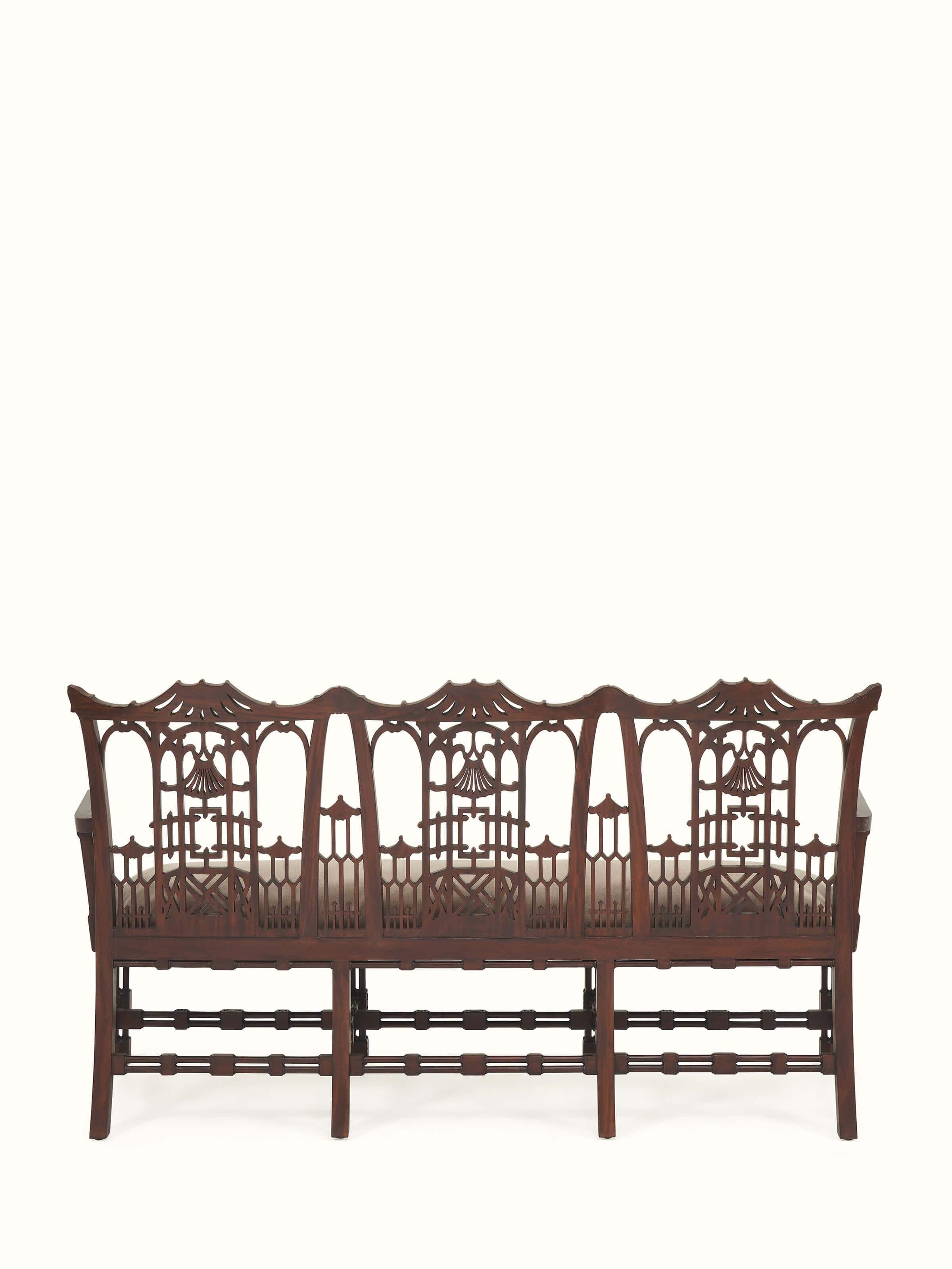 Back view of upholstered mahogany wood 3-seater sofa showcasing solid frame and clean upholstery finish