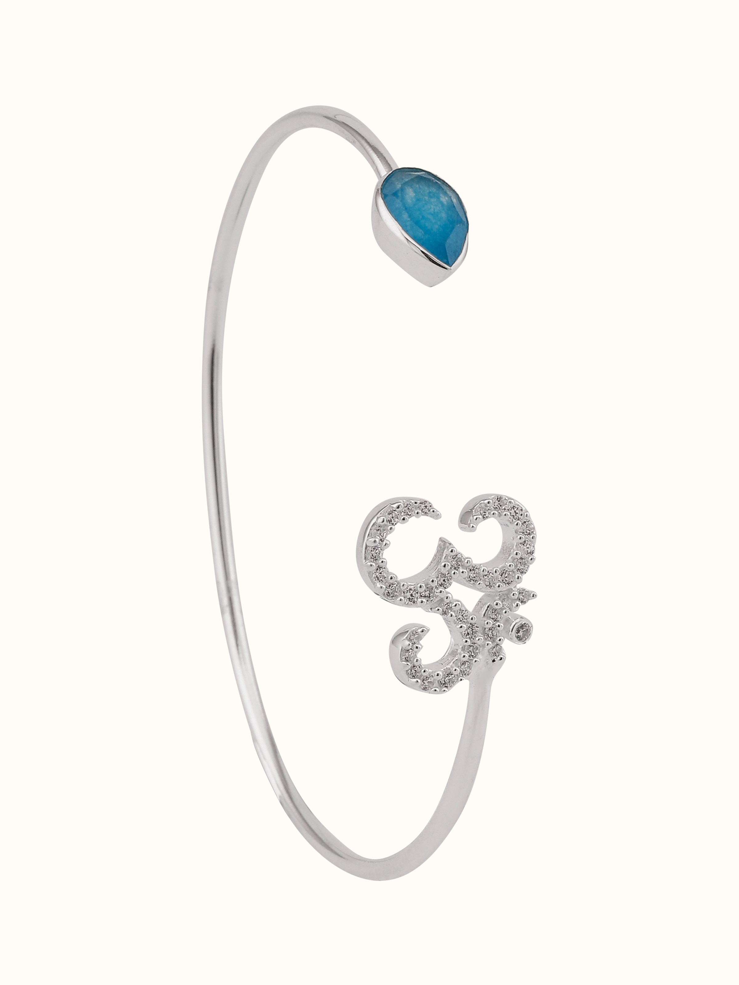 Front view of silver bracelet with green and white jade beads and Om charm for balance and spiritual energy