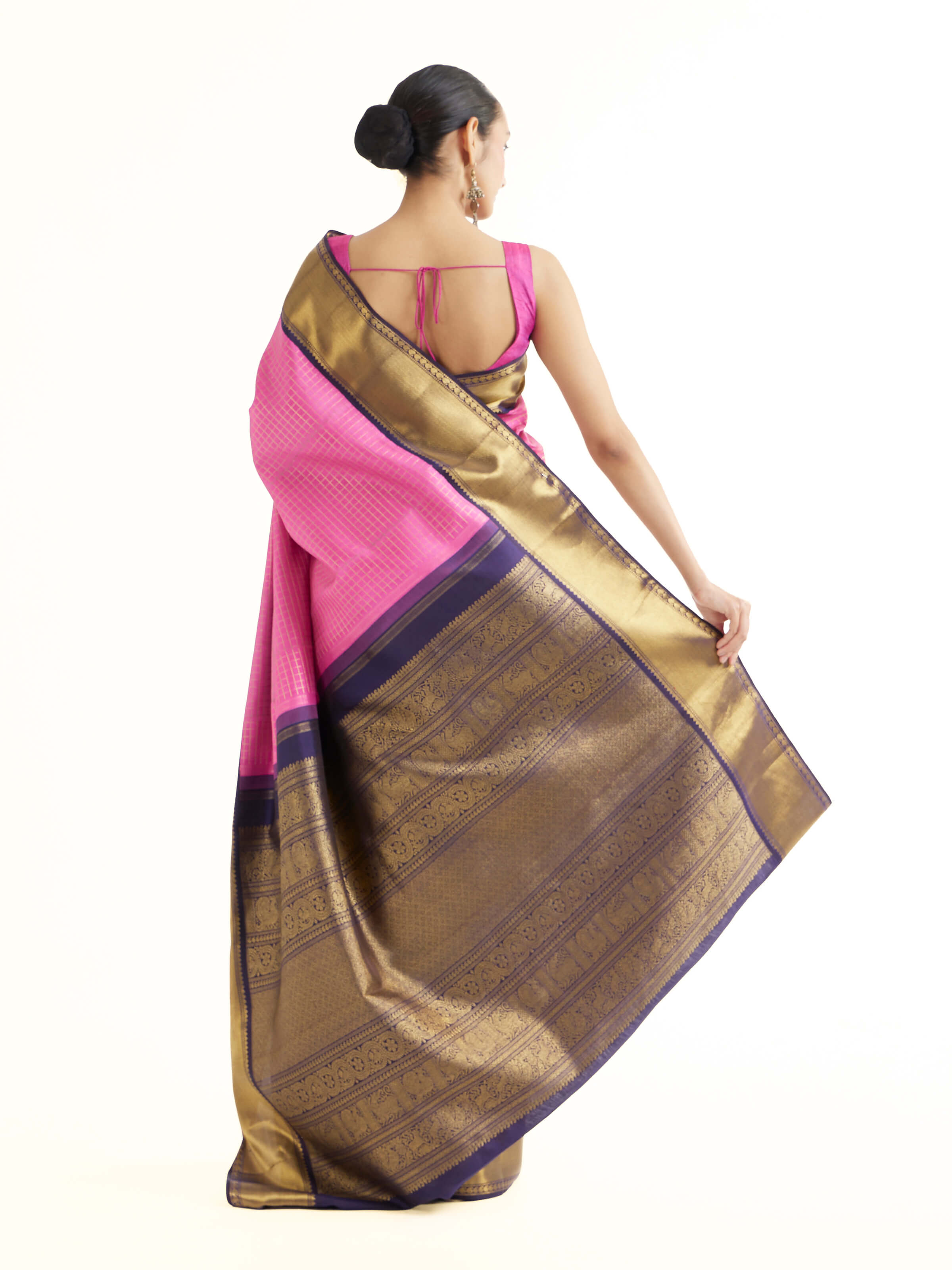 Back view of mauve silk Kancheepuram saree displaying ornate pallu design