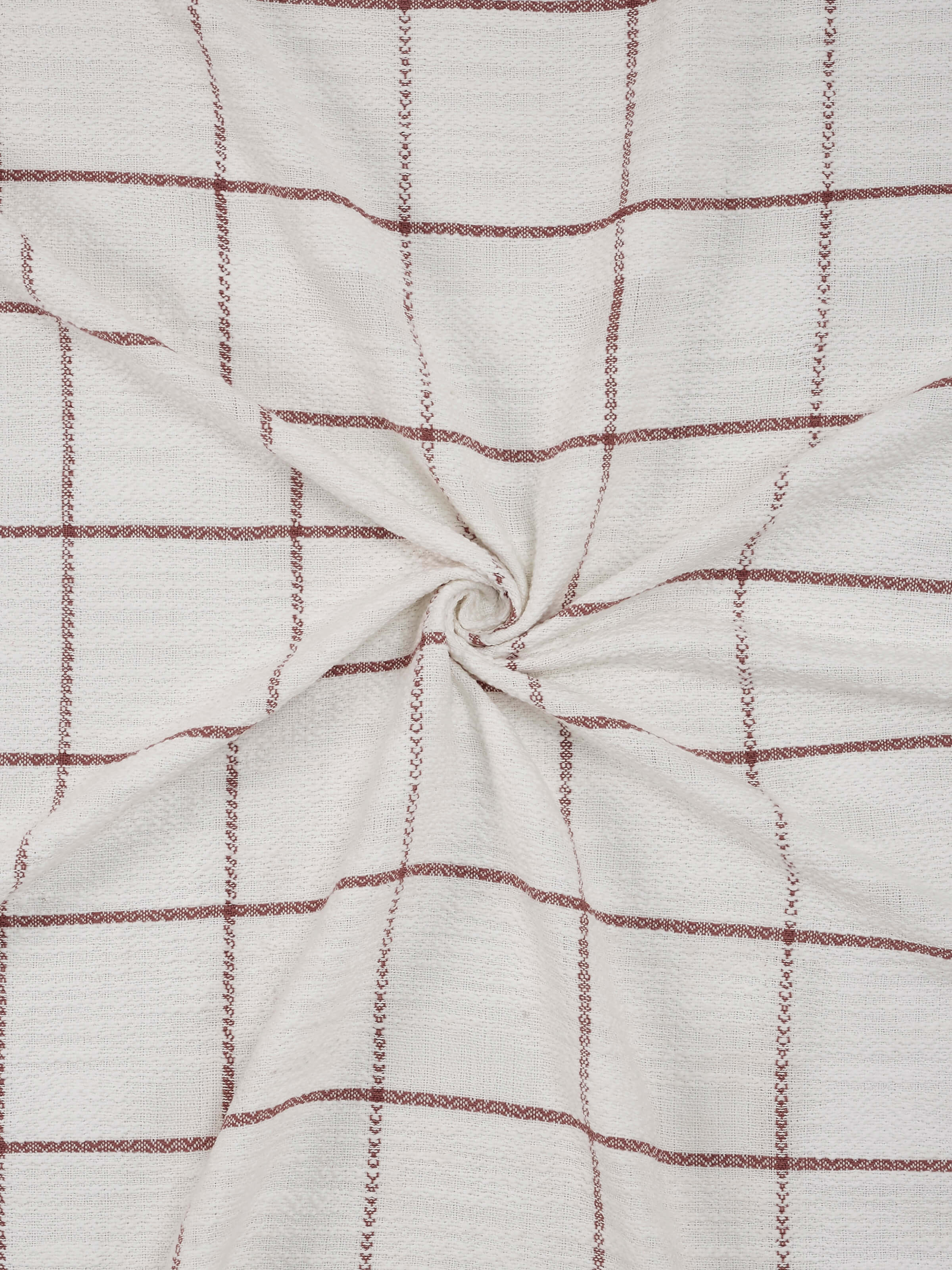 Close-up highlighting blush tone, twill weave, and handloom craftsmanship.