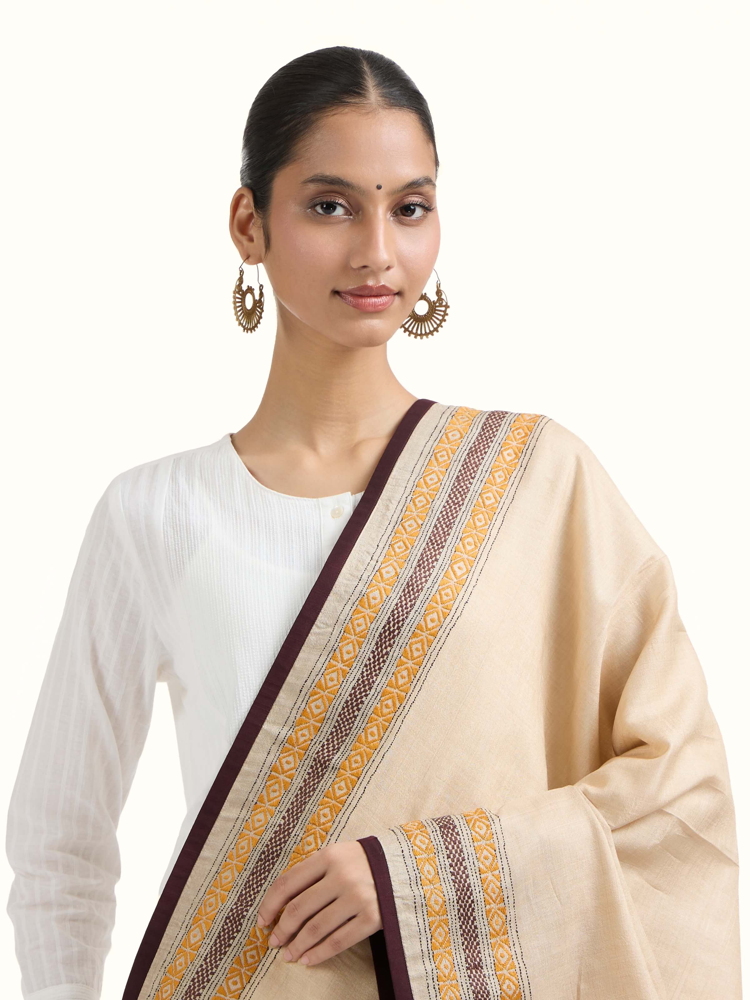 Angled view of beige tussar silk kantha embroidered dupatta emphasizing kantha stitch work