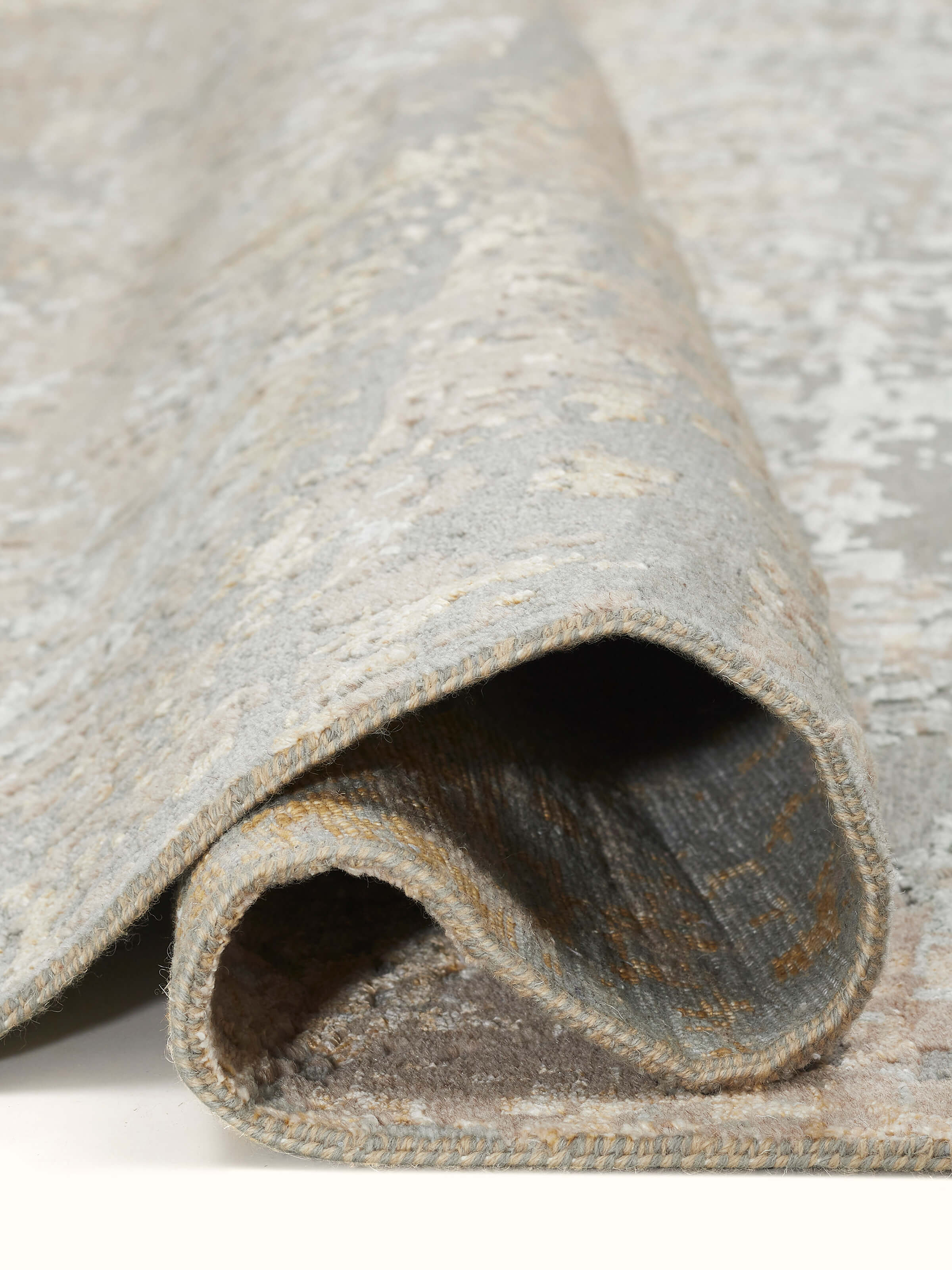Angled perspective focusing on the carpet’s distressed details and craftsmanship