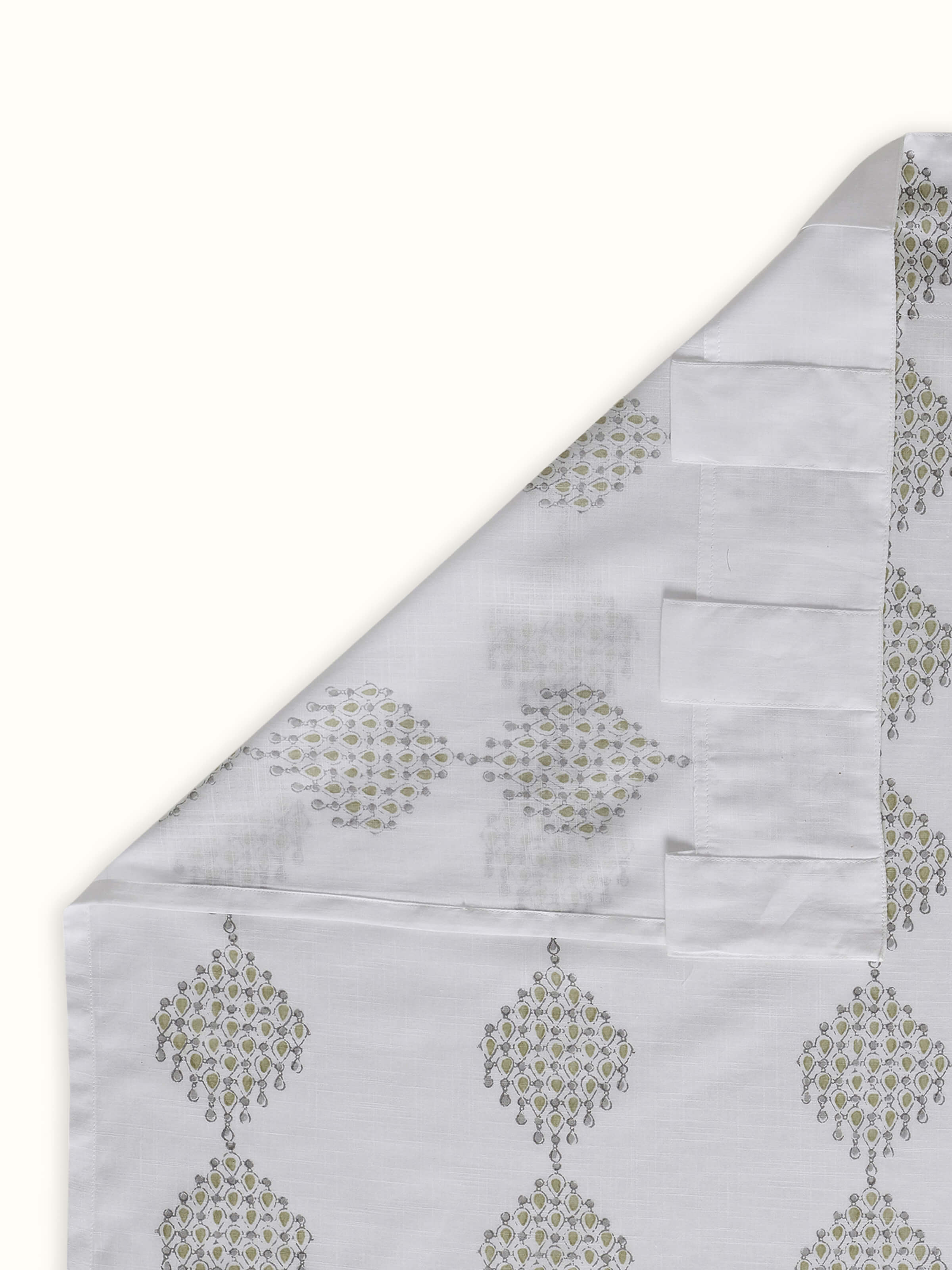 Back view showing cotton weave and clean finish of white and green printed curtain.