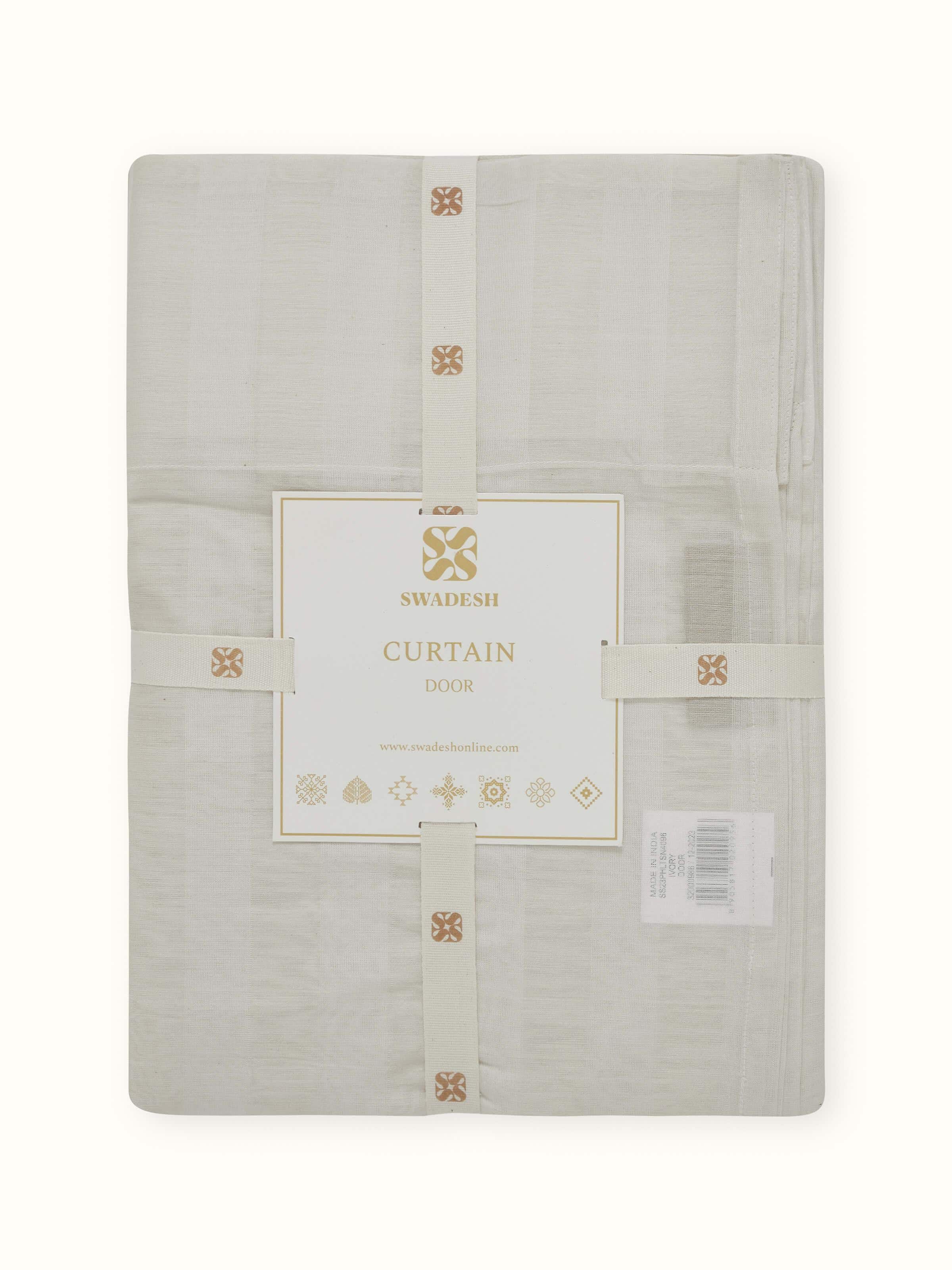 Detail shot of sheer panels showing handloom texture and fluidity.