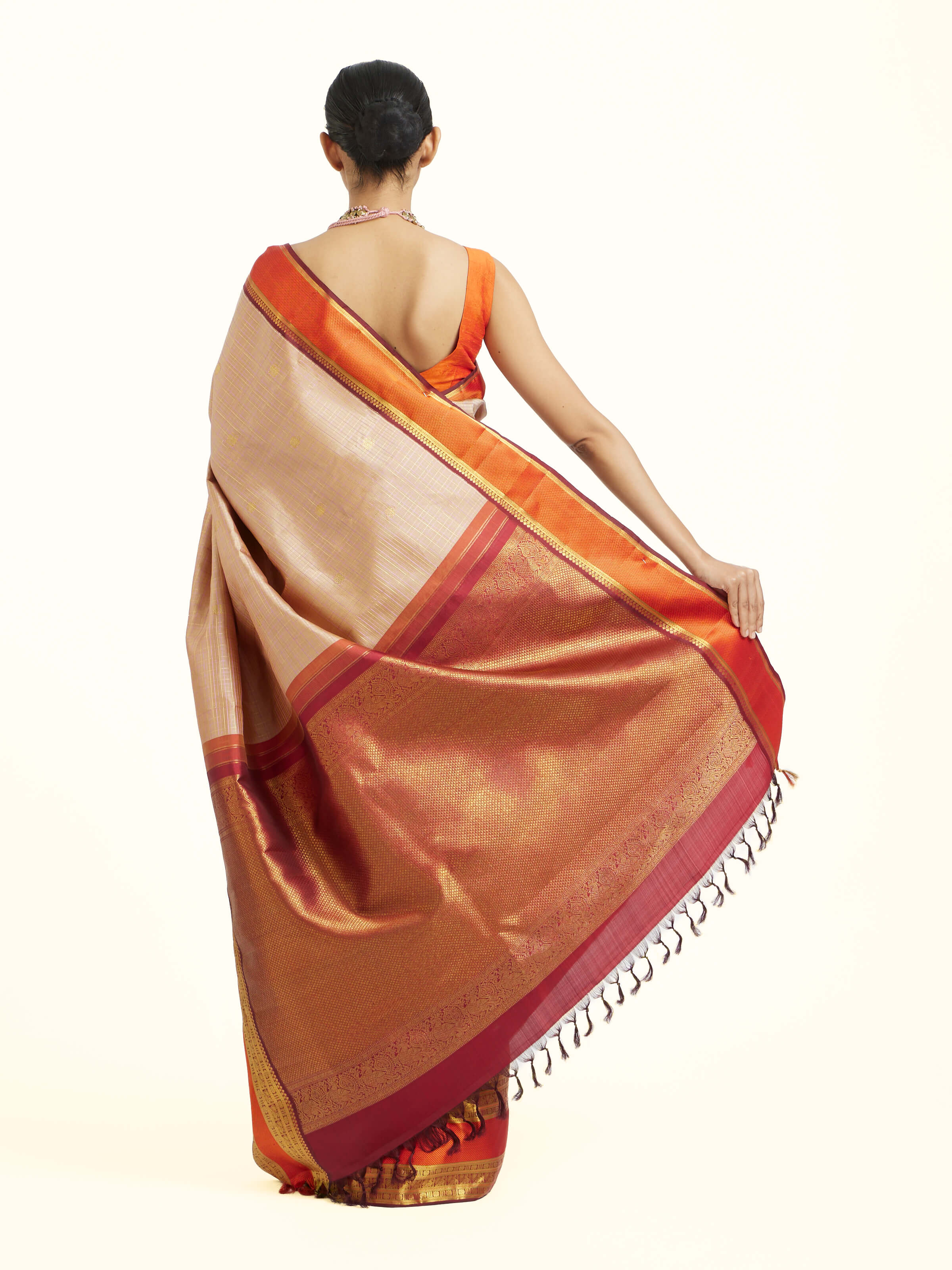 Back view of biscuit silk Kancheepuram saree displaying grand pallu