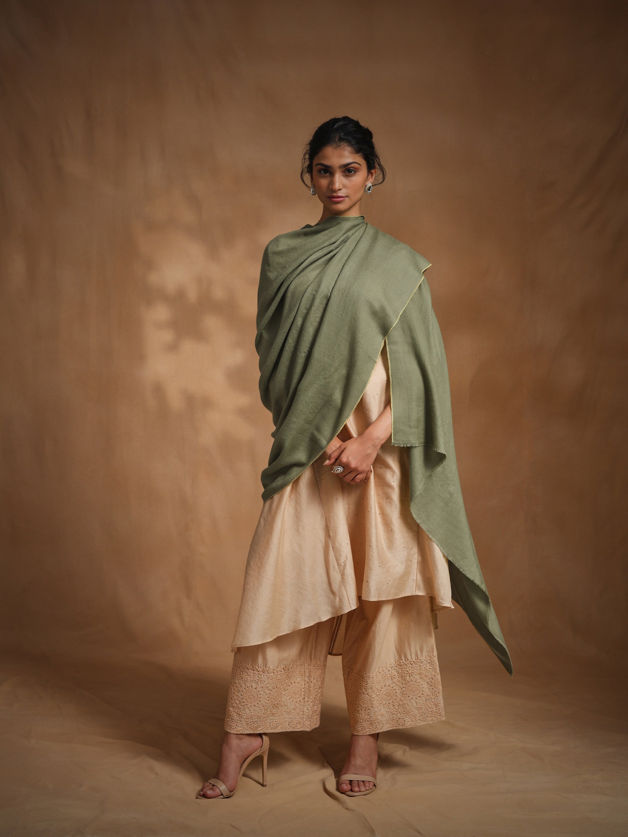 Side view of green cashmere Kaaj embroidered handwoven stole highlighting detailed handwoven patterns
