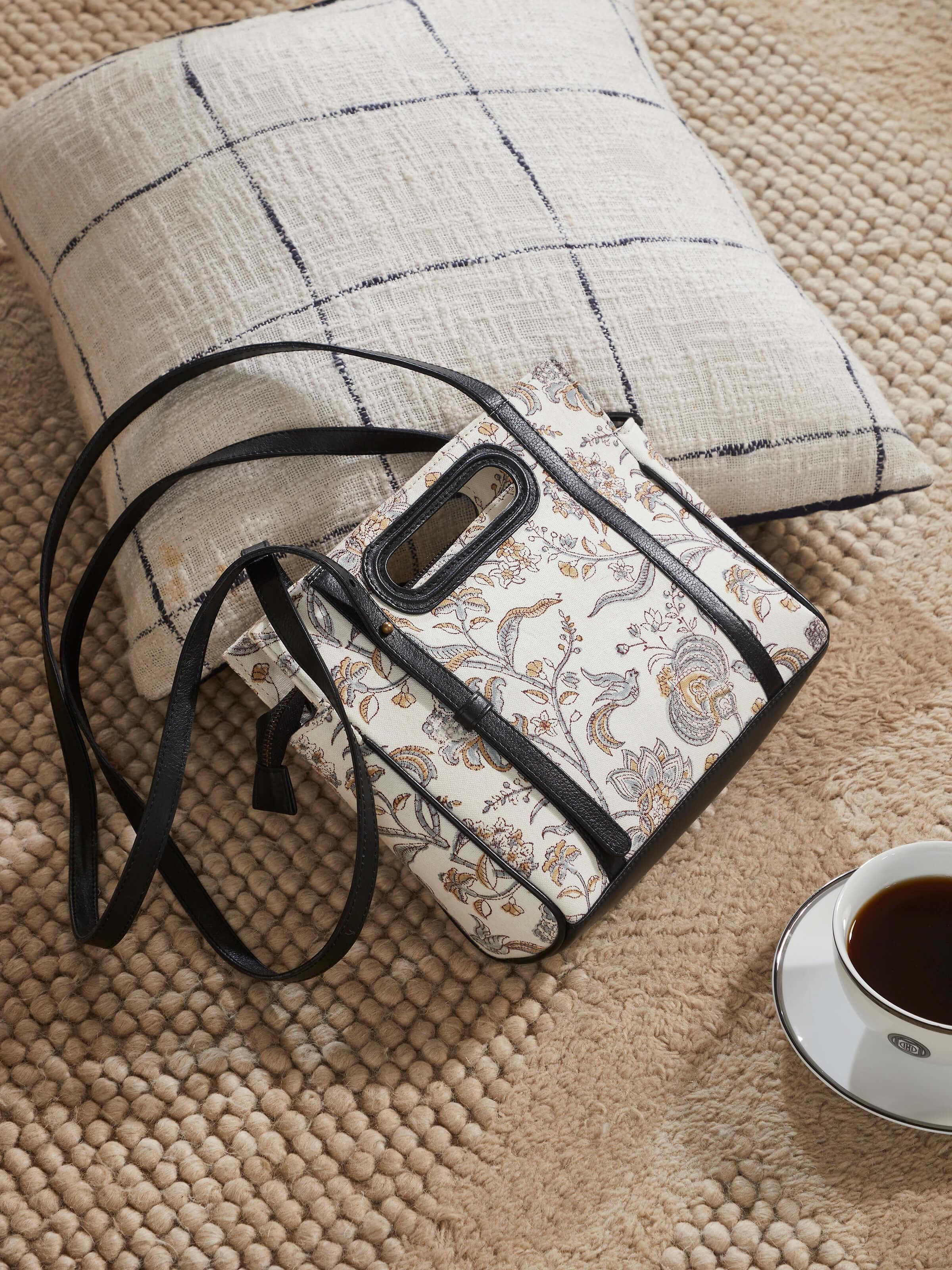 Lifestyle image showing the sling bag styled with an ethnic outfit.