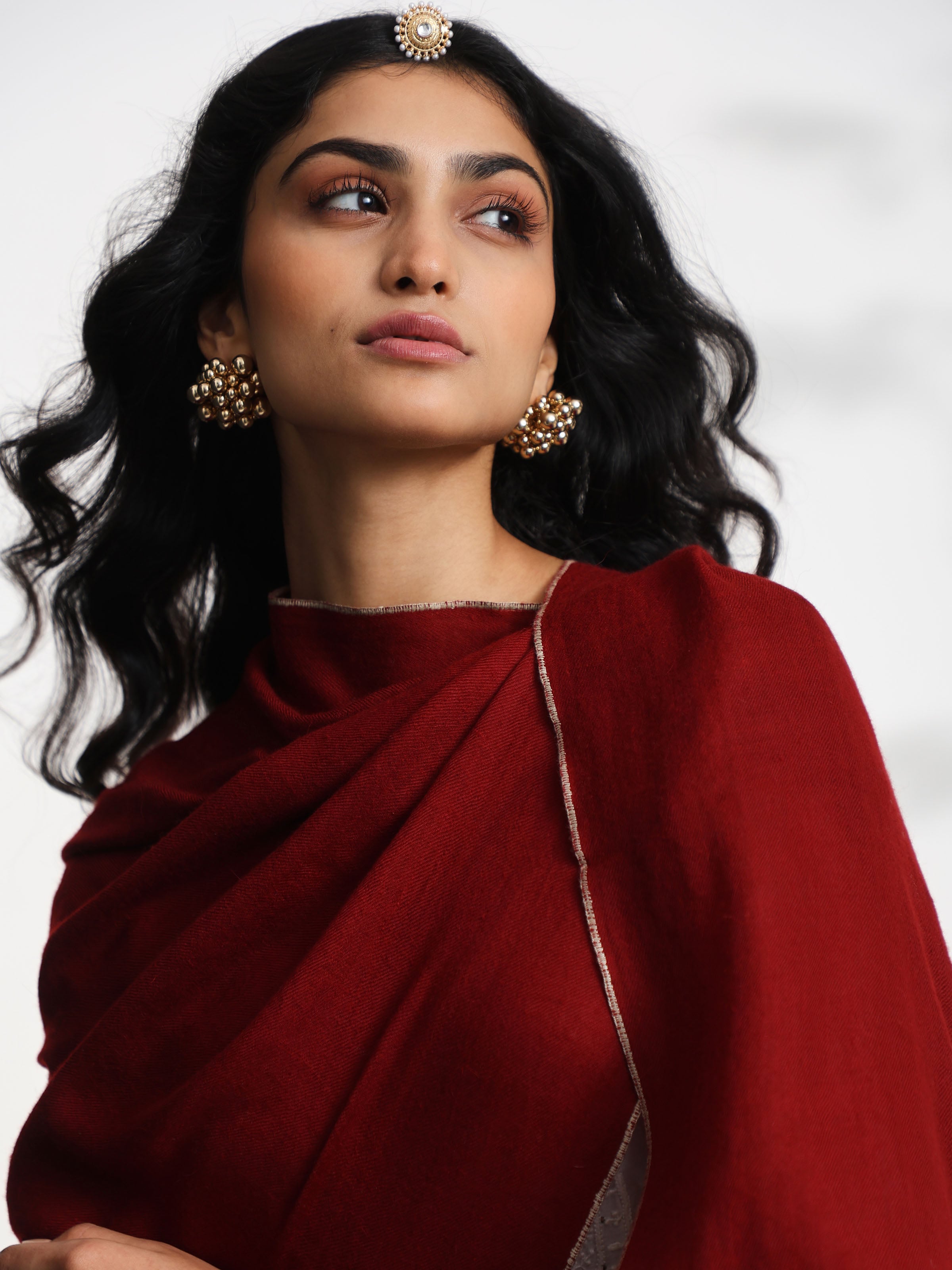 Detail view of maroon cashmere kaaj embroidered handwoven stole showing soft texture