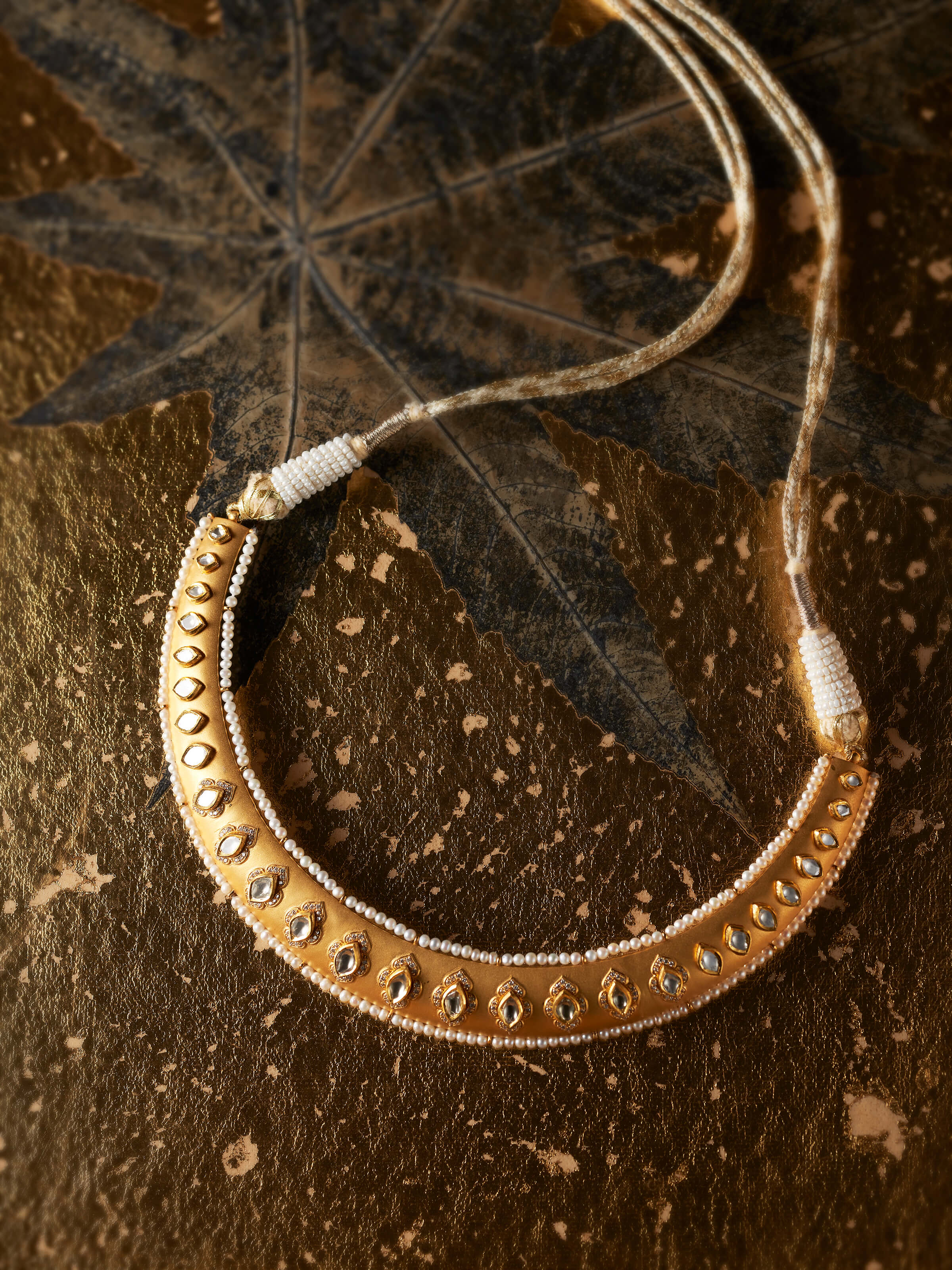 lifestyle view of dank polki 14 karat gold collar necklace