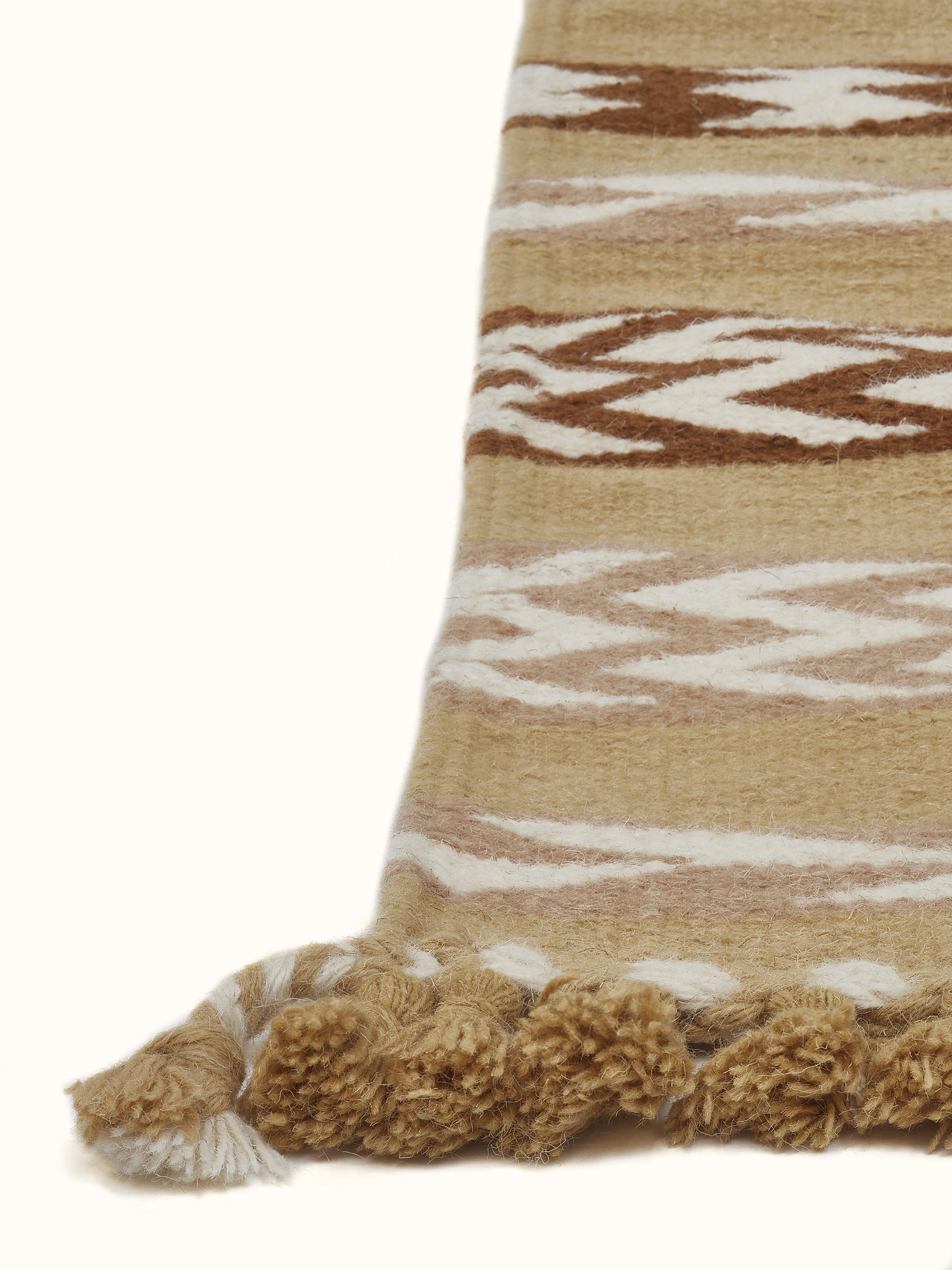 Angle view of Chevron Stripes Yellow Gujarat Wool & Cotton Panja Dhurrie Kharad displaying the chevron pattern.