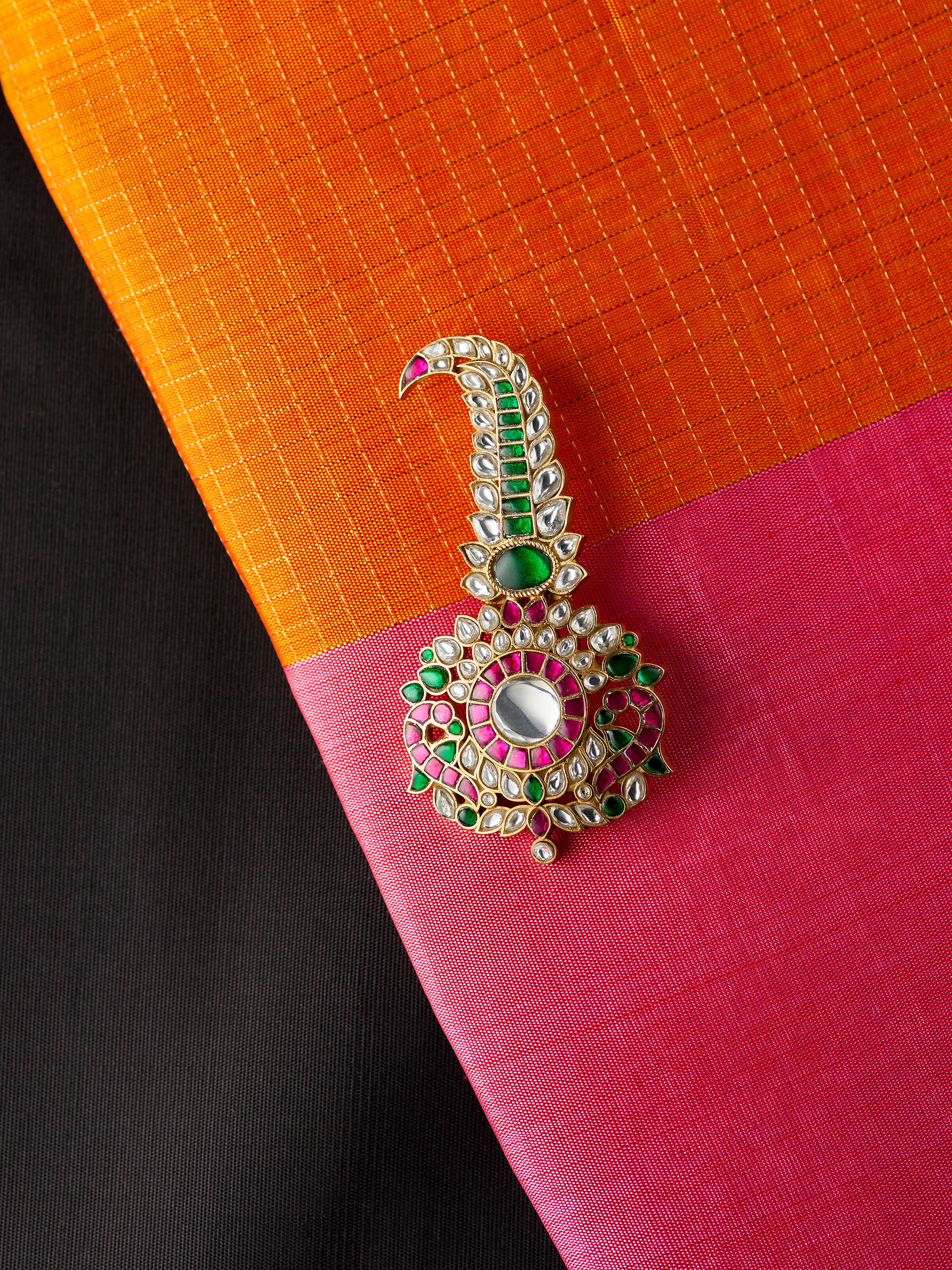 lifestyle view of silver smithing yellow gold brooch pin