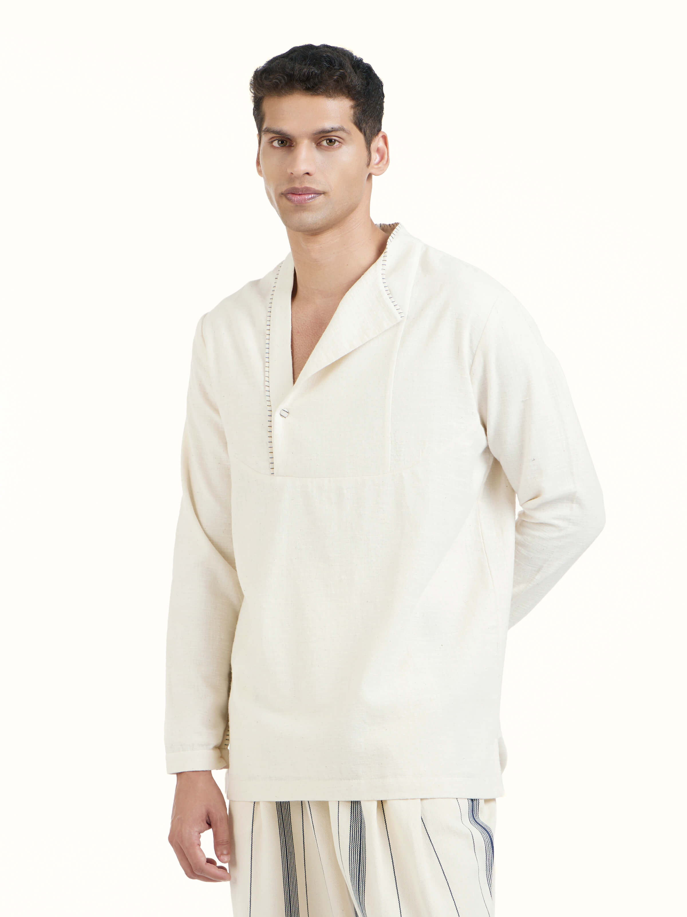 Angled view of ivory cotton handloom short kurta highlighting fabric texture
