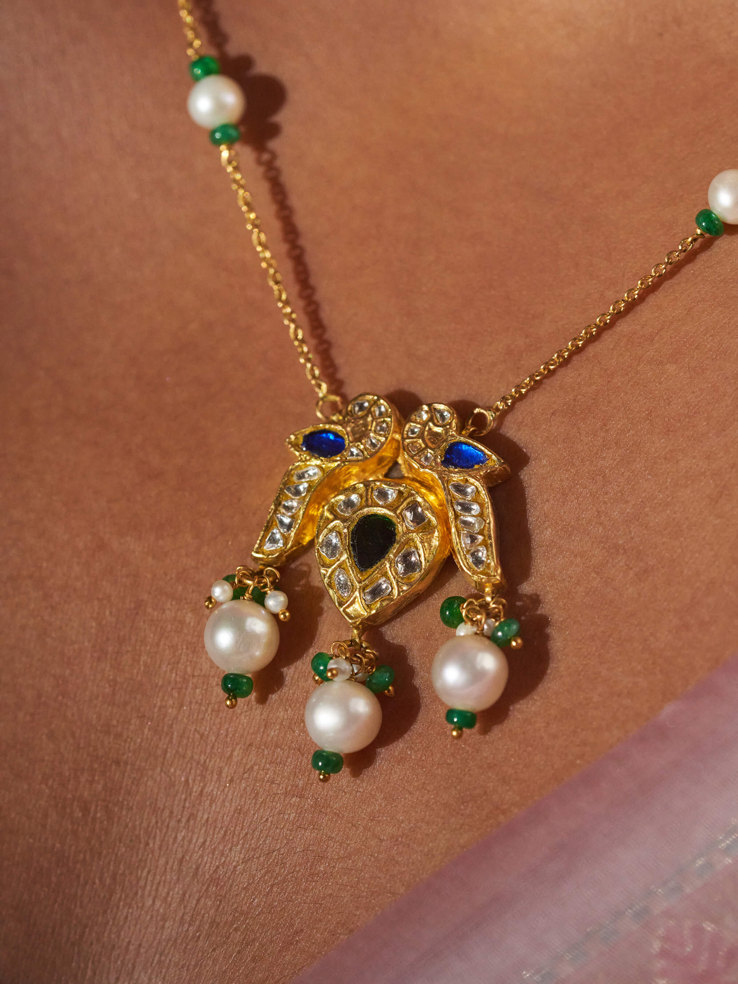 Close-up view of Swadesh Thappa 22 Karat Gold Pendant highlighting rich texture and cultural artistry