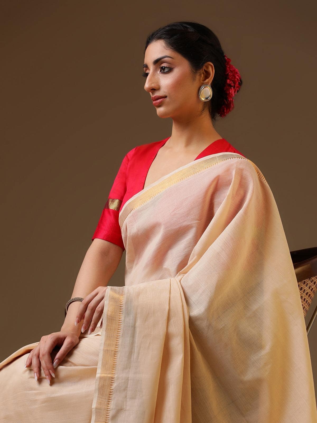 Angled view of off-white gossamer and cotton Mangalgiri saree showing fabric texture