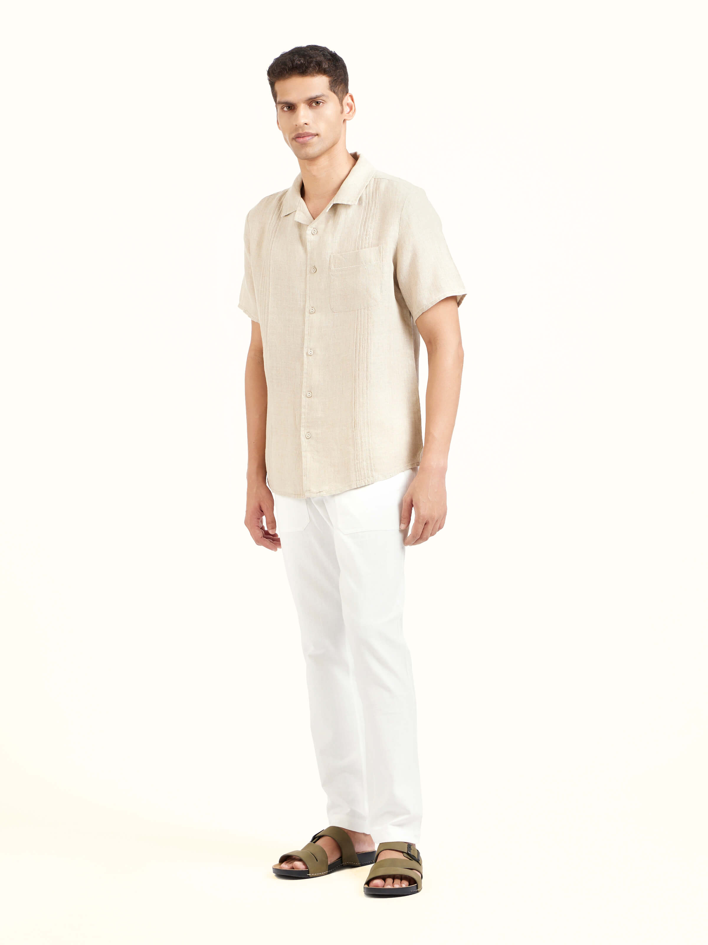 Side view of beige Cuban collar linen shirt showcasing relaxed fit