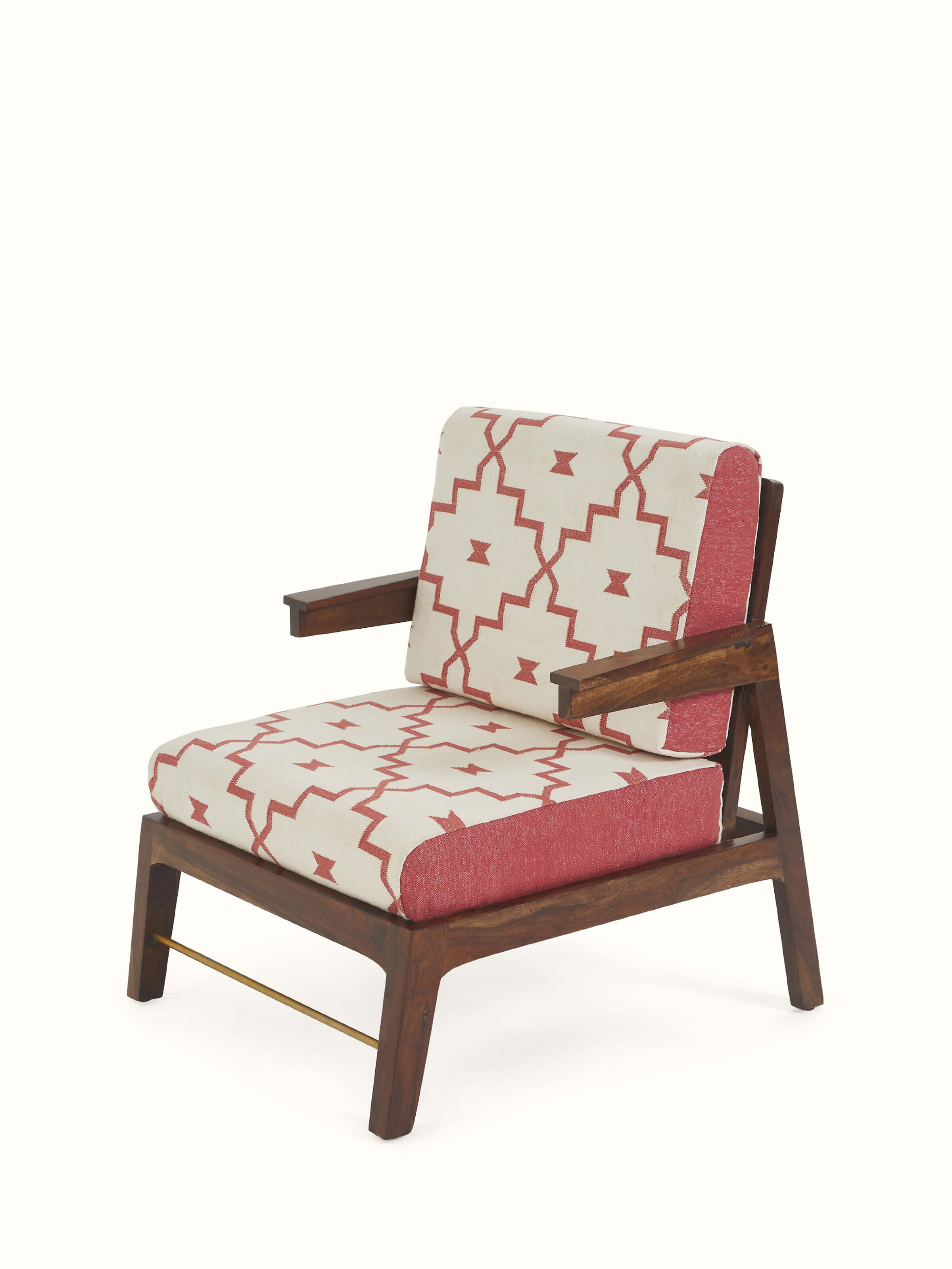 Angled view of artisanal Sheesham wood armchair with colorful dhurrie upholstery – Swadesh furniture collection