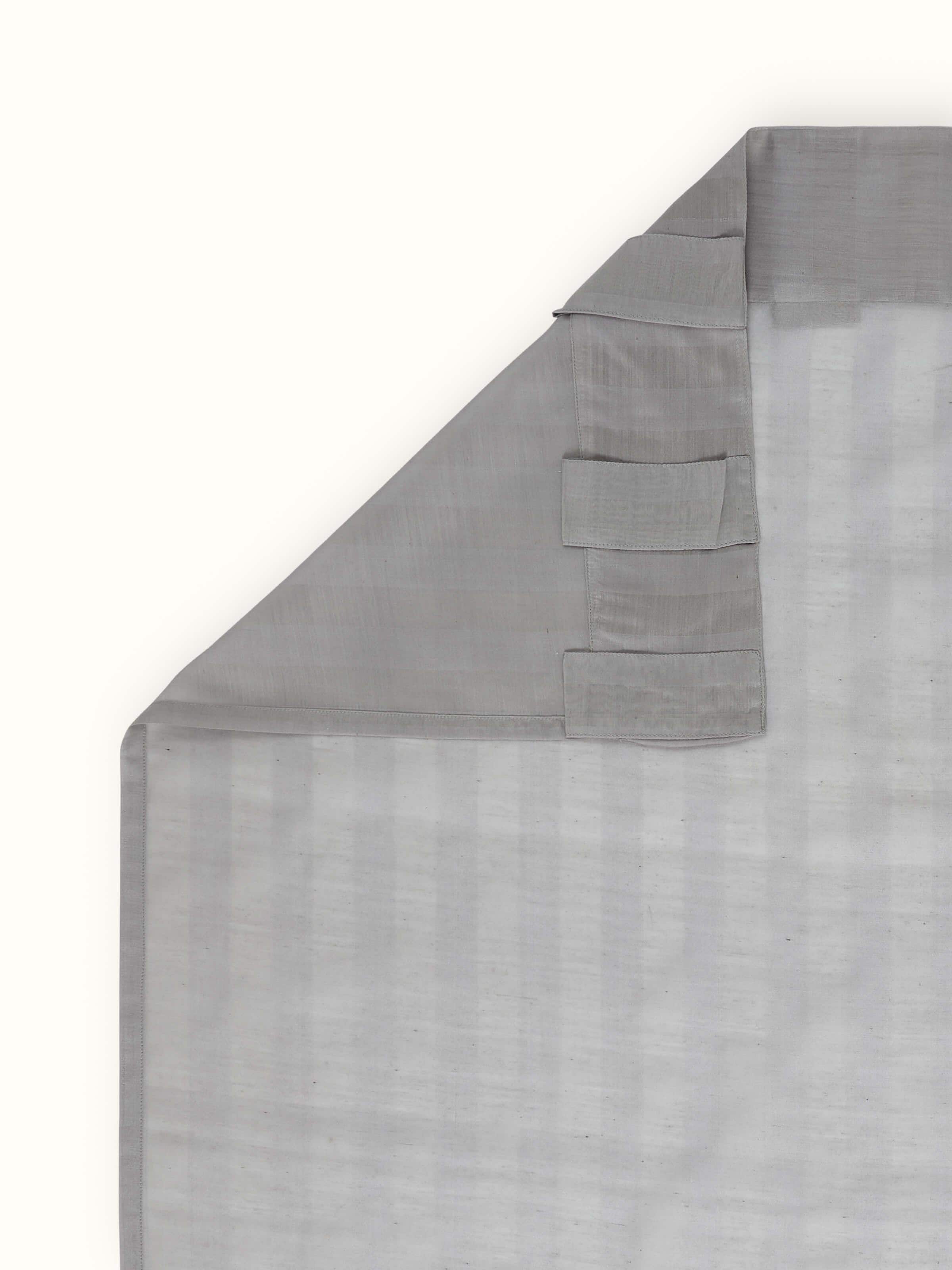 A rear view showing the sheer fabric quality, weave detail, and length of the Pragya Wide Stripe Maheshwari Curtain by Swadesh.