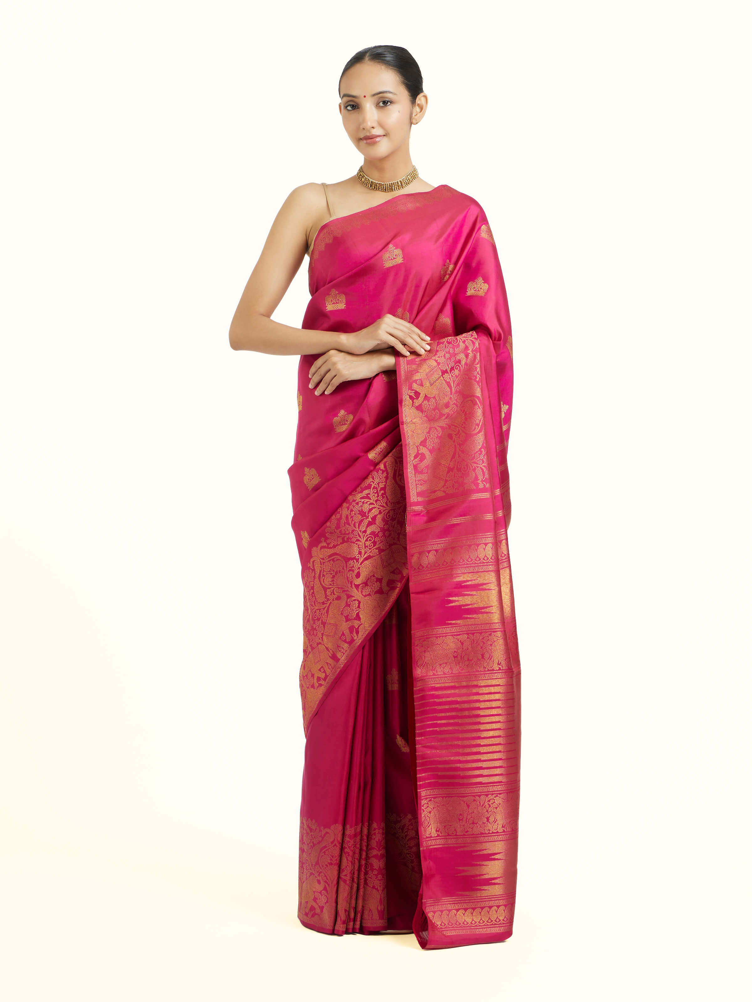 Front view of red silk Kancheepuram saree showcasing vibrant hue and lustrous silk
