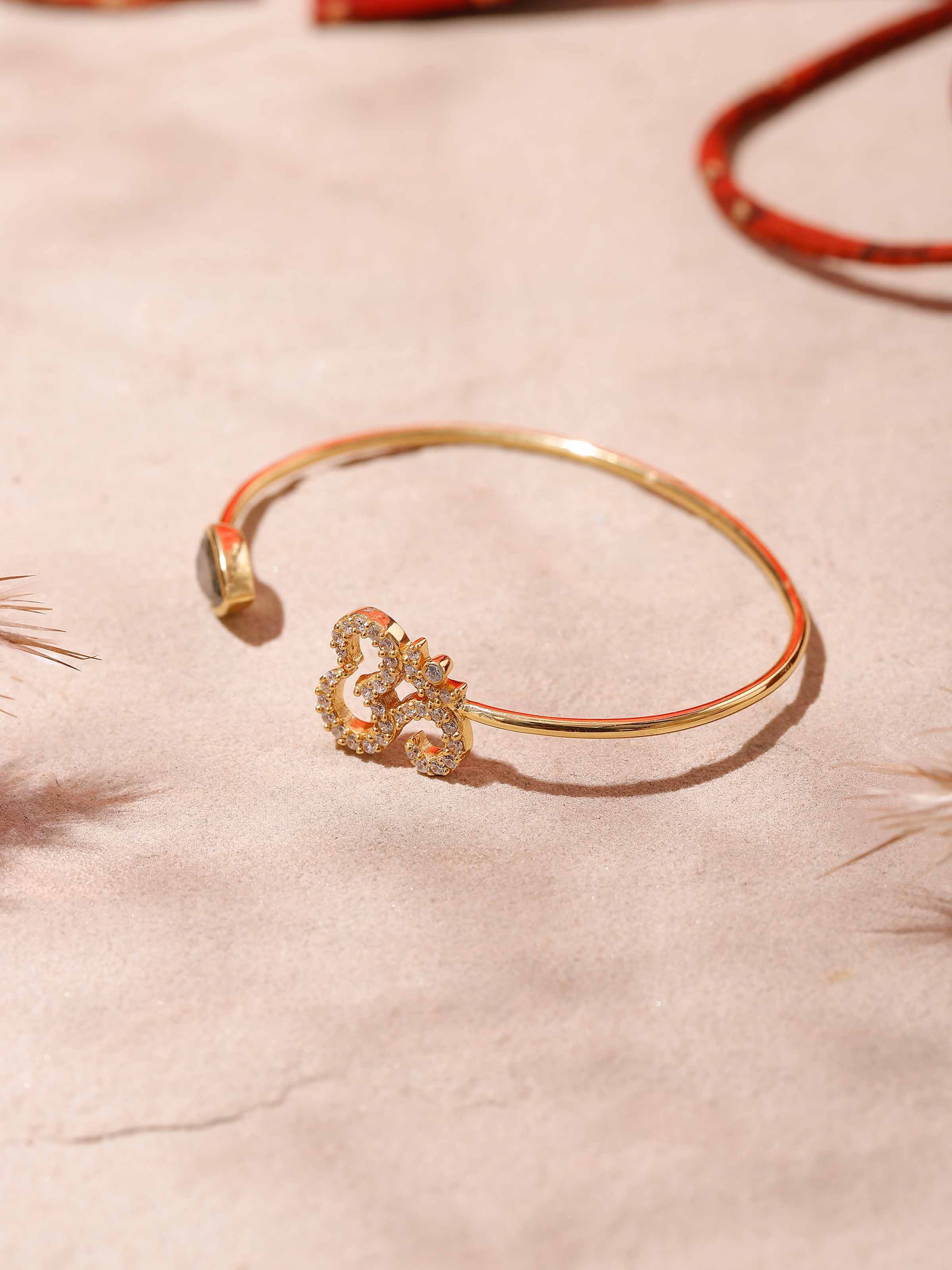 Side view of Labradorite & Om Bracelet, emphasizing the 18K gold plating and fine detailing