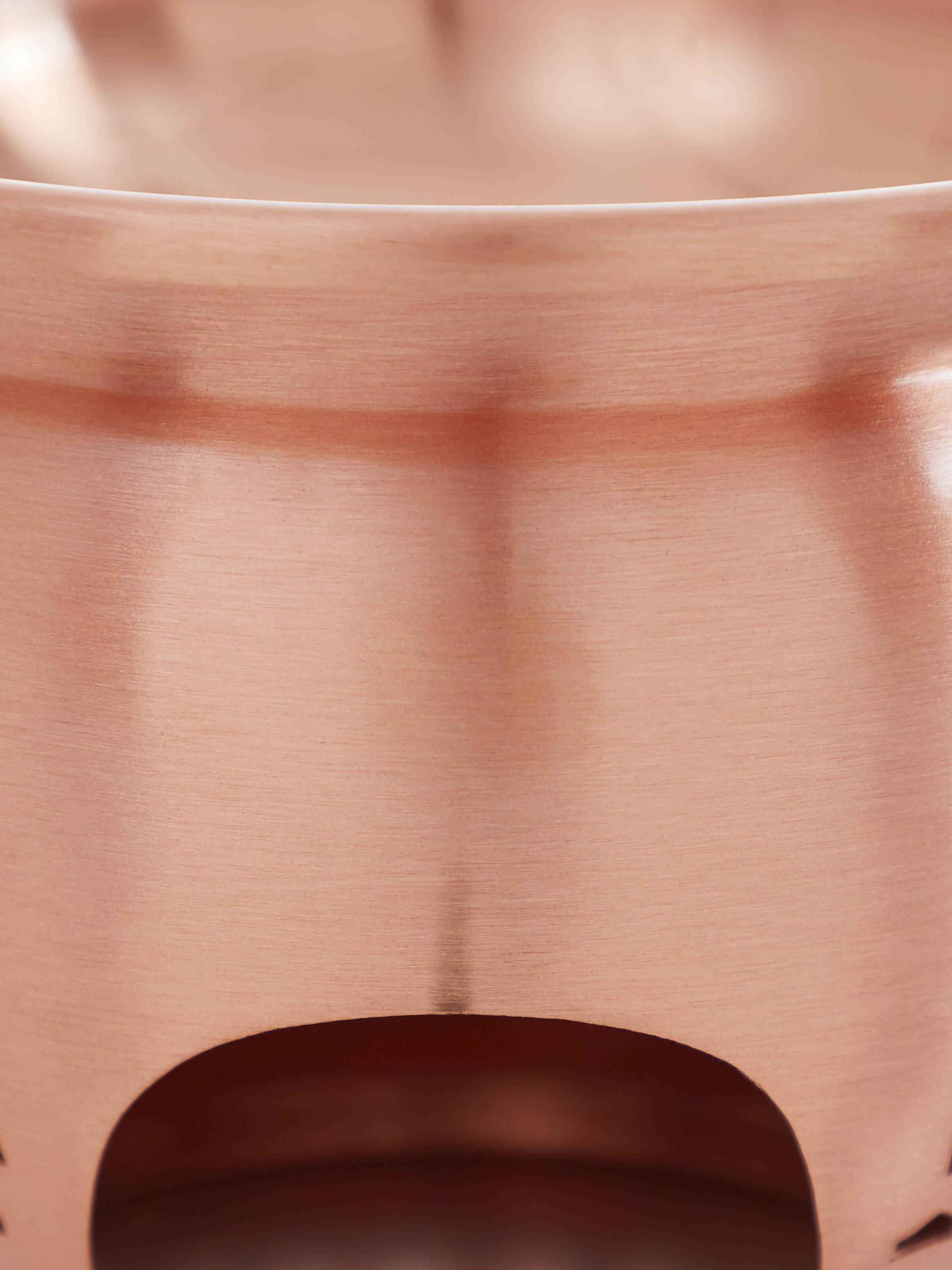 Detailed back view of natural copper diffuser showcasing its smooth texture and quality finish