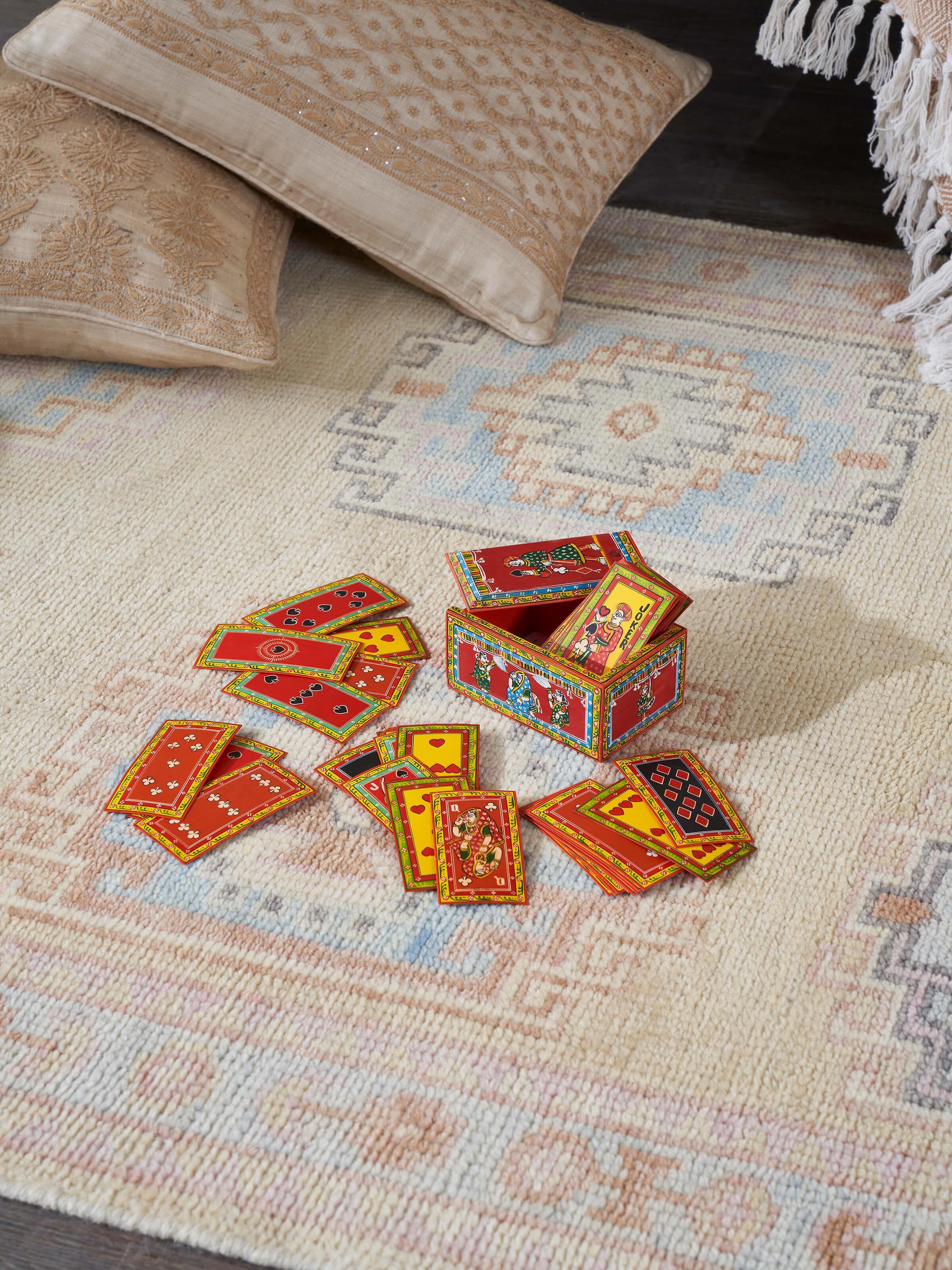 Side view of Ganjifa paper cards (54pcs) showcasing their elaborate designs and bright colors