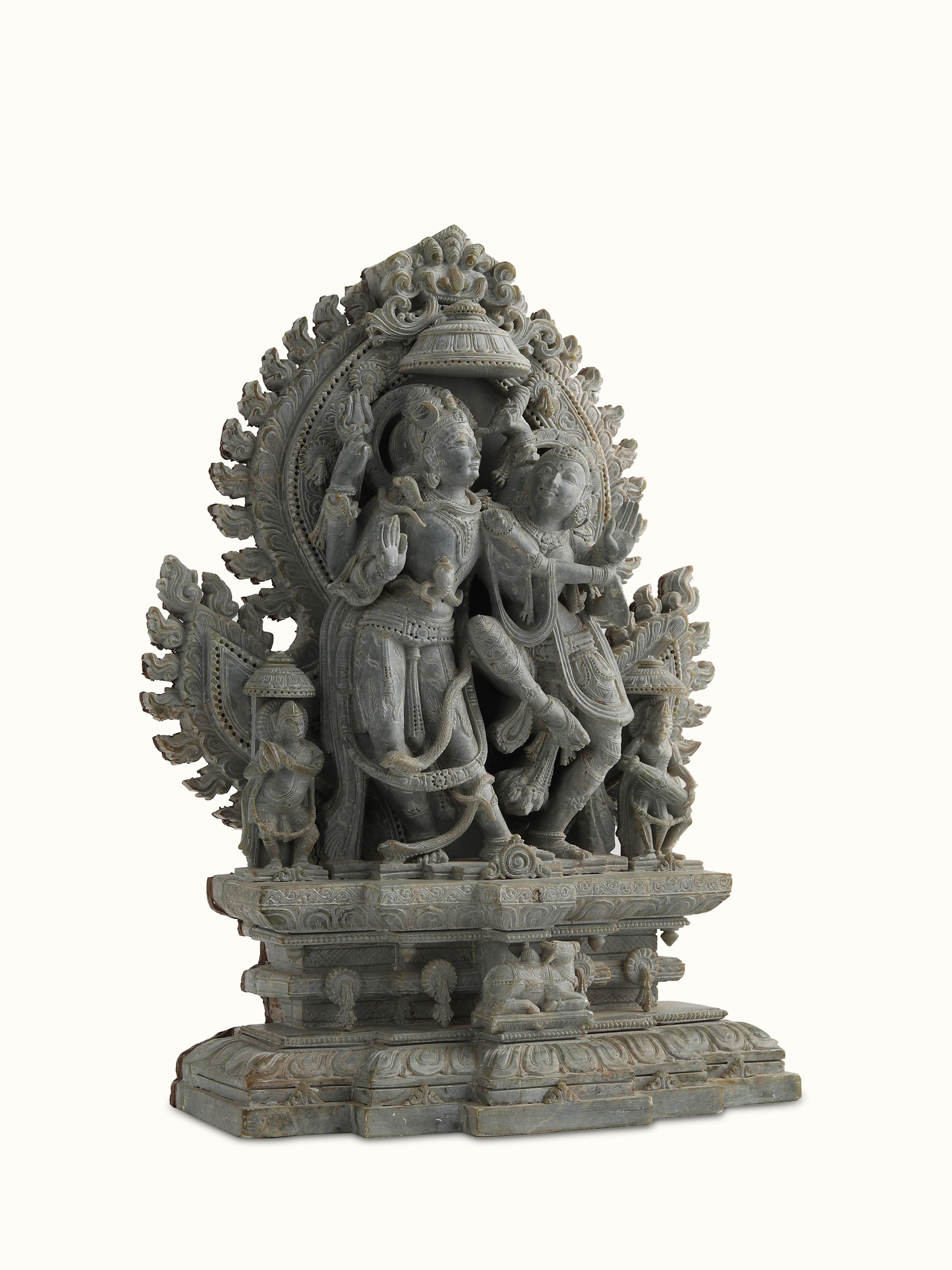 Angled view of Shiva Parvati Stone Idol, highlighting the detailed carvings and harmonious design.