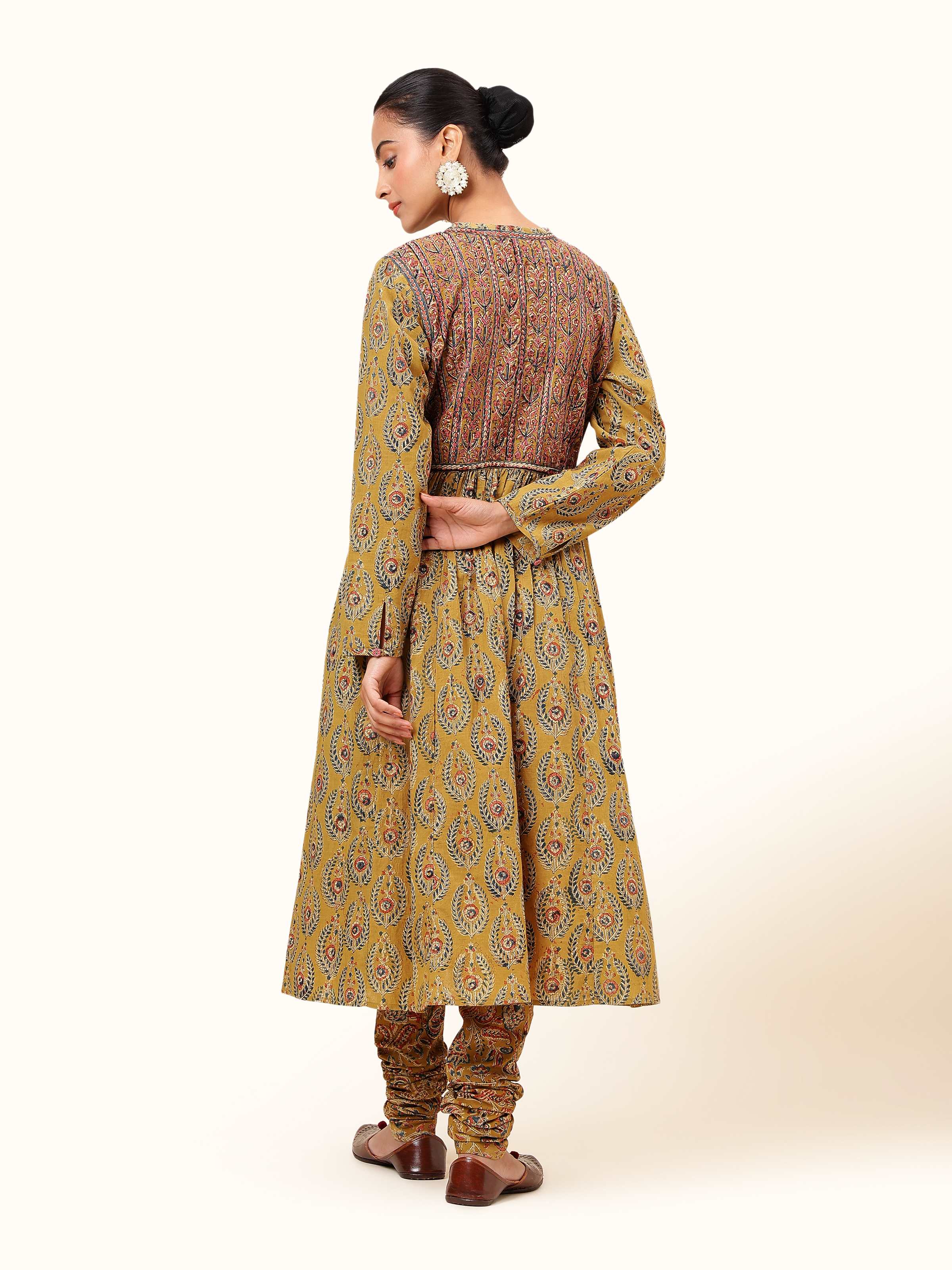 Back view of Yellow Cotton Kalamkari Block Printed Churidaar revealing continuous block print and cotton fabric.