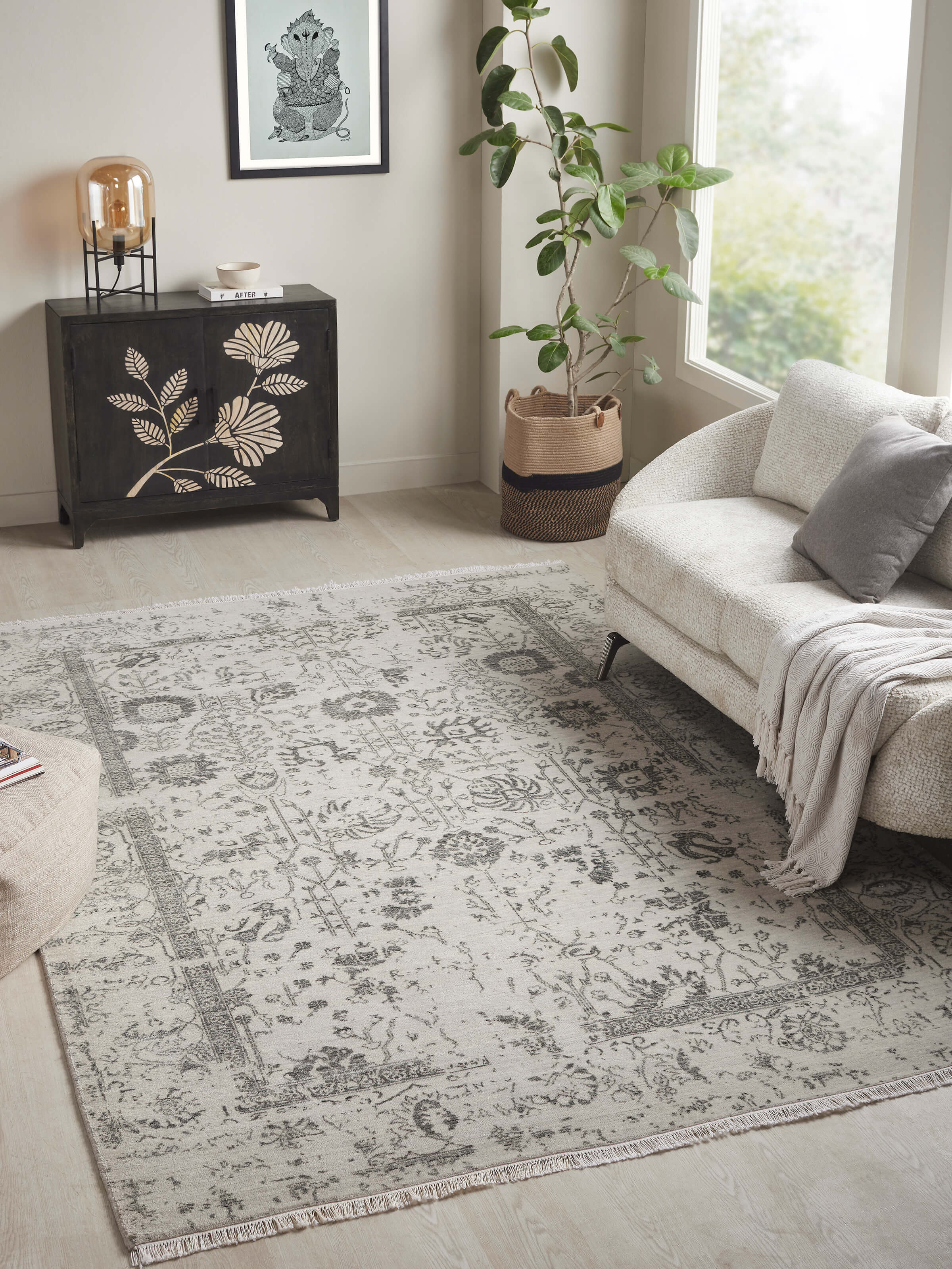 Lifestyle scene featuring grey charcoal Agra wool-viscose rug with a modern textured look