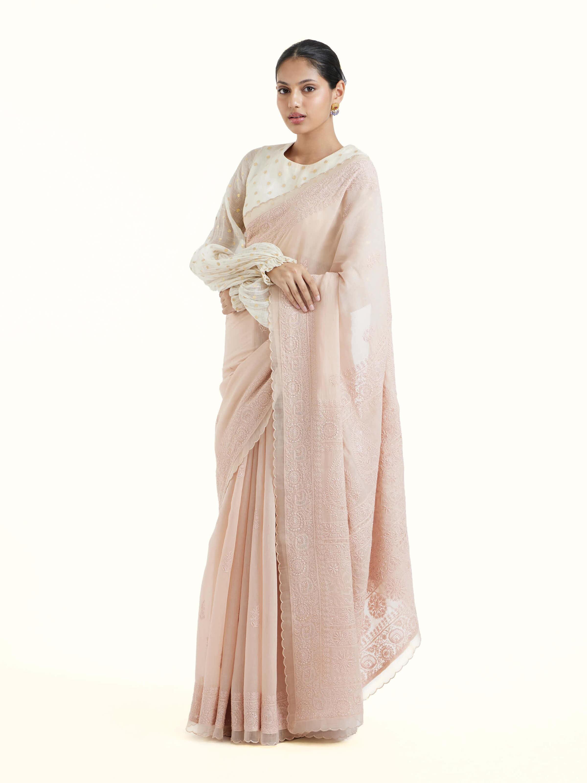 Side view of pink cotton silk chikankari saree with graceful fall
