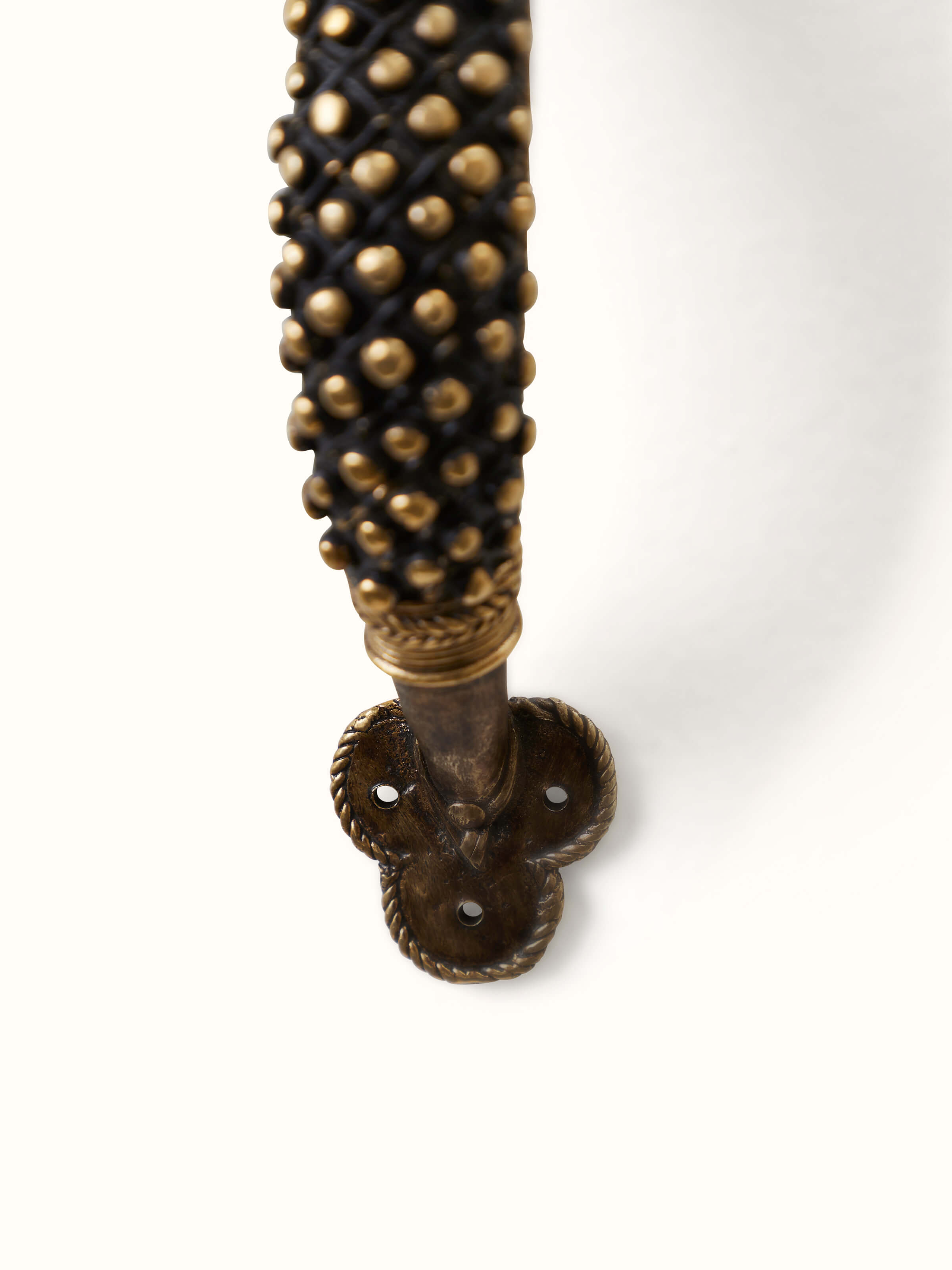 Angled view of Dhokra Brass Small Balls Door Handle showing the elegant design and detailed brass finish