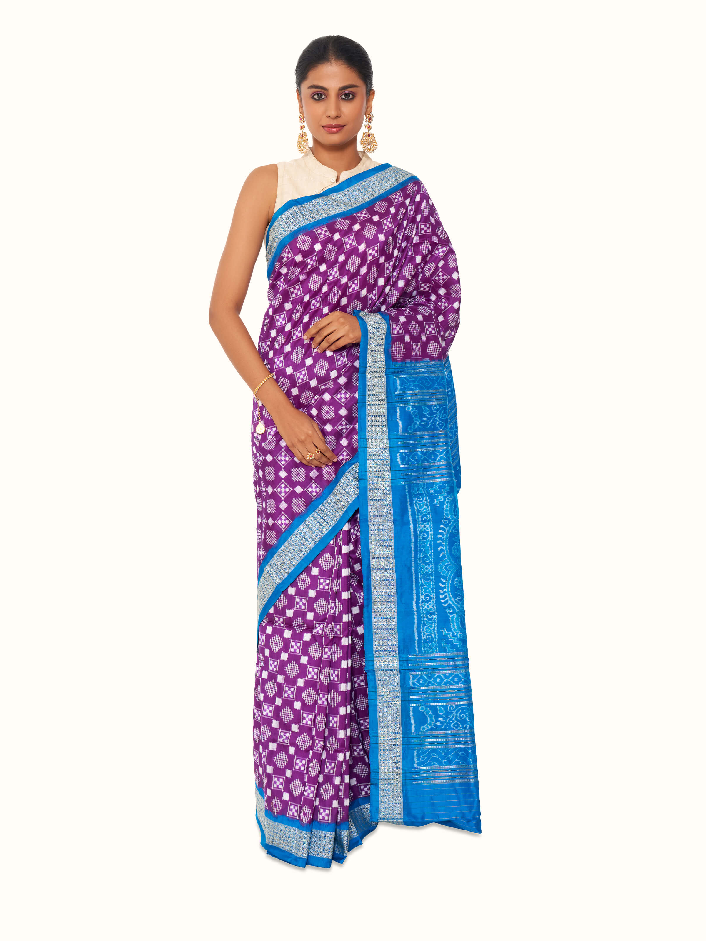 Front view of turquoise mulberry silk bandha Odisha ikat saree with vibrant woven motifs