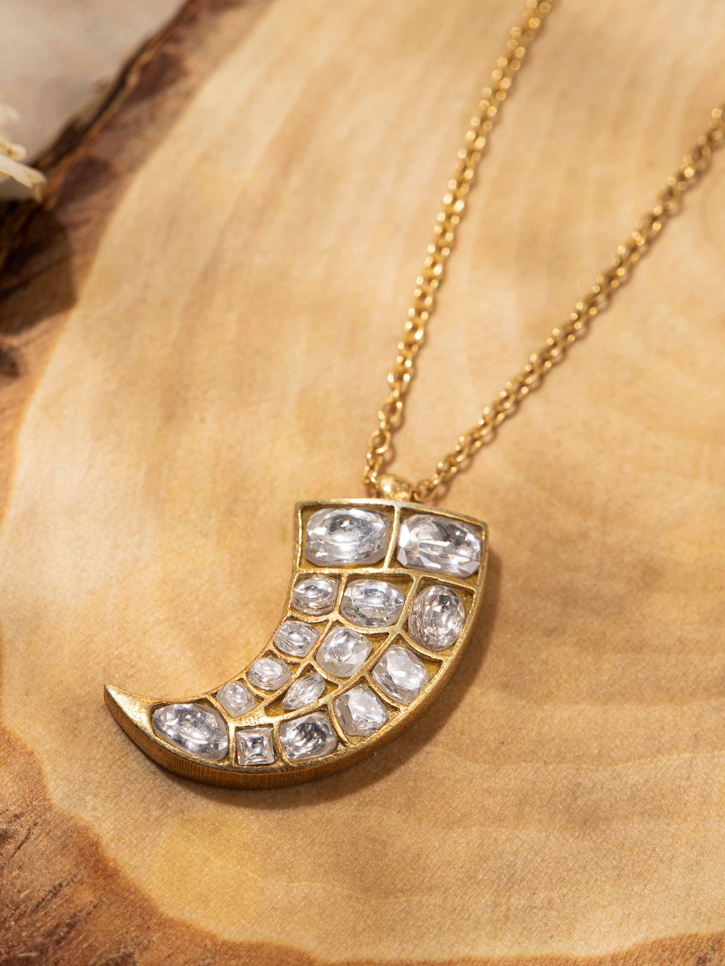 Detail shot capturing the delicate craftsmanship and smooth texture of the pendant