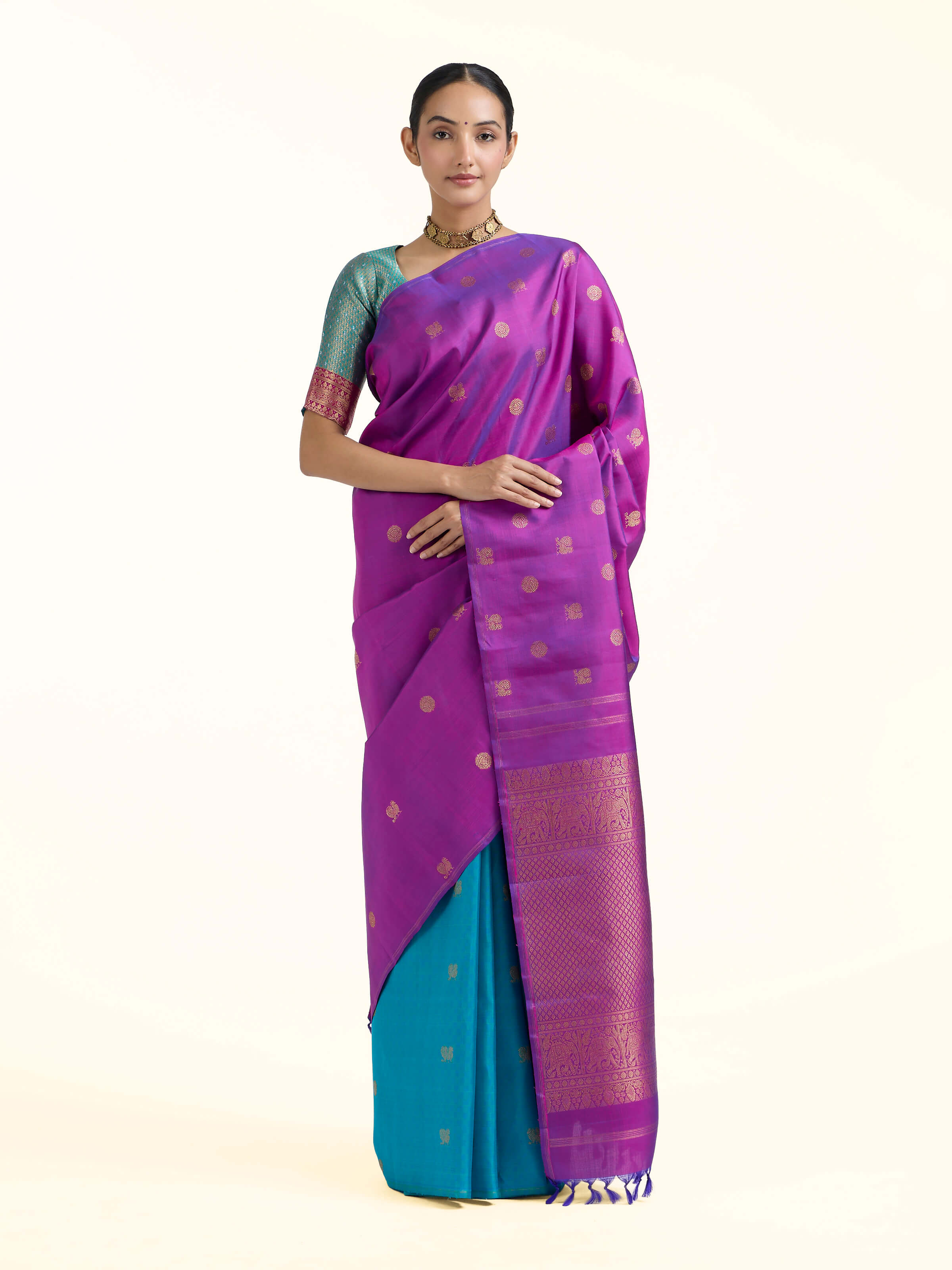 Front view of purple silk Kancheepuram saree with rich zari motifs