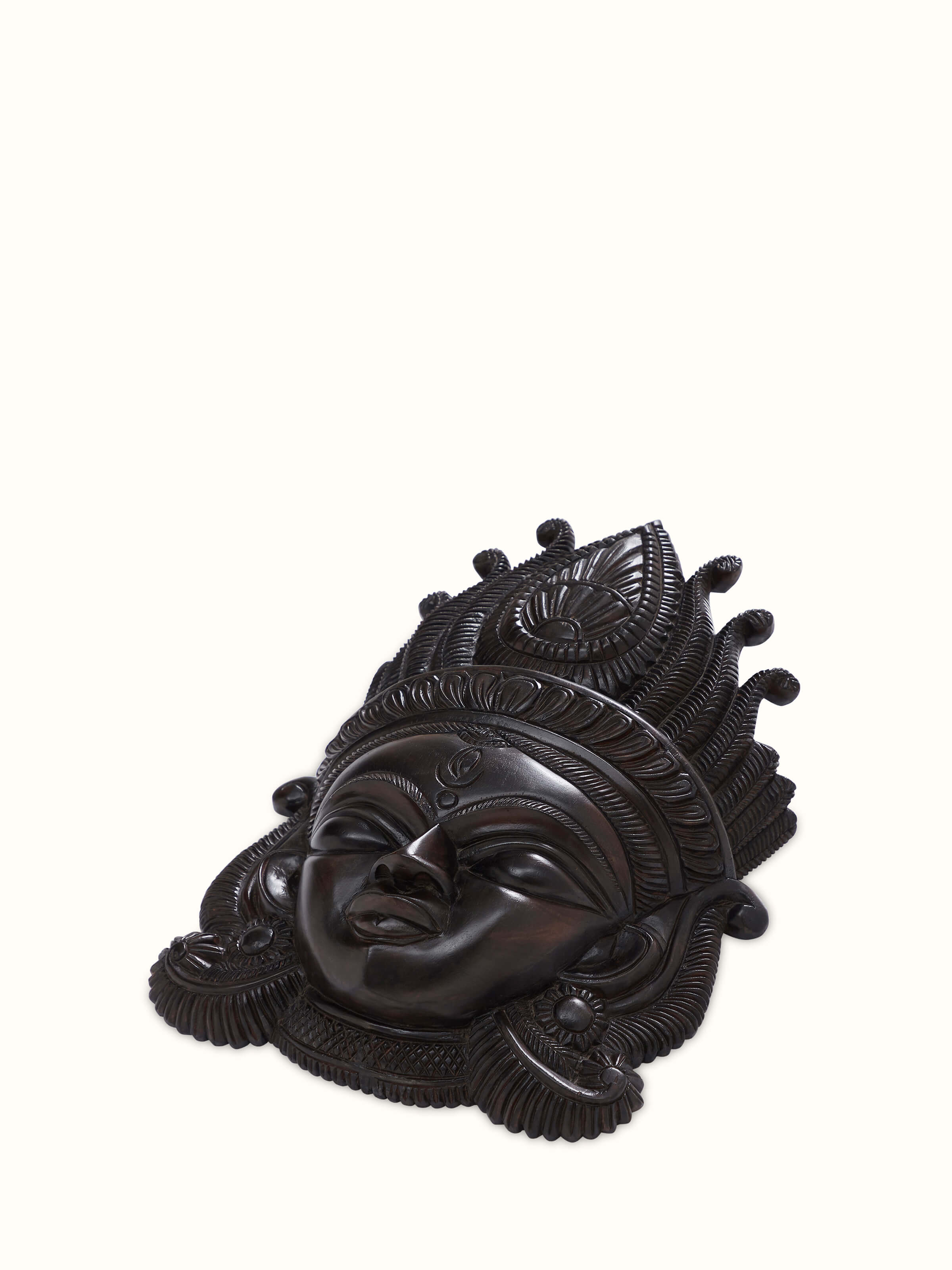 Angled view of Kushmandi Devi Wall Mask