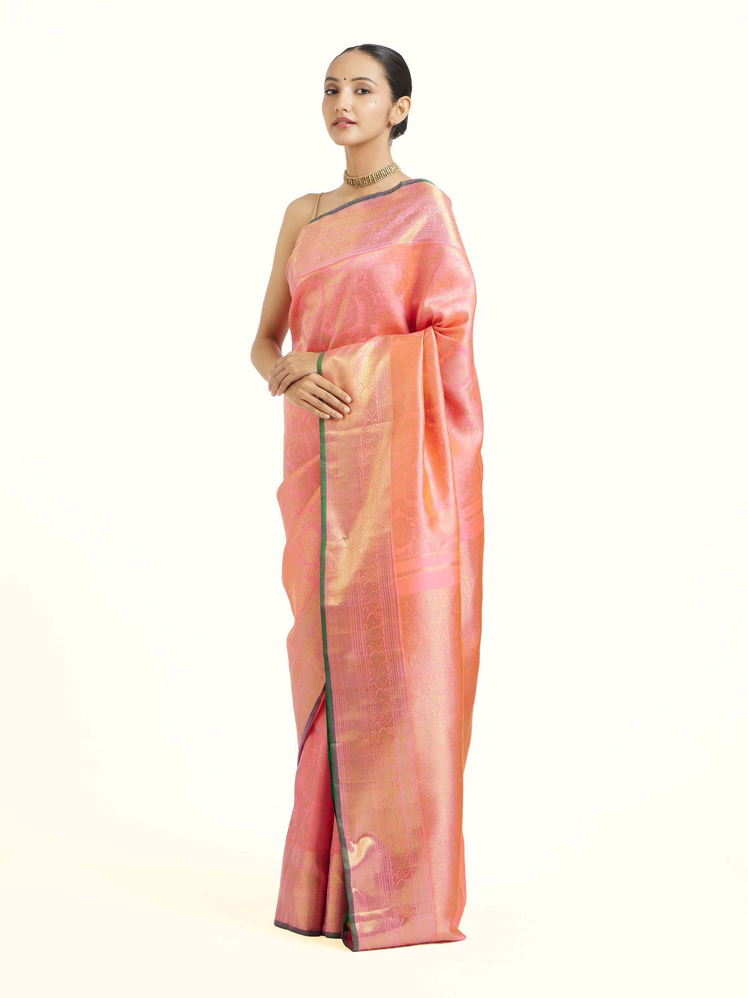 Side view of pink silk Kancheepuram saree with graceful drape and contrast border