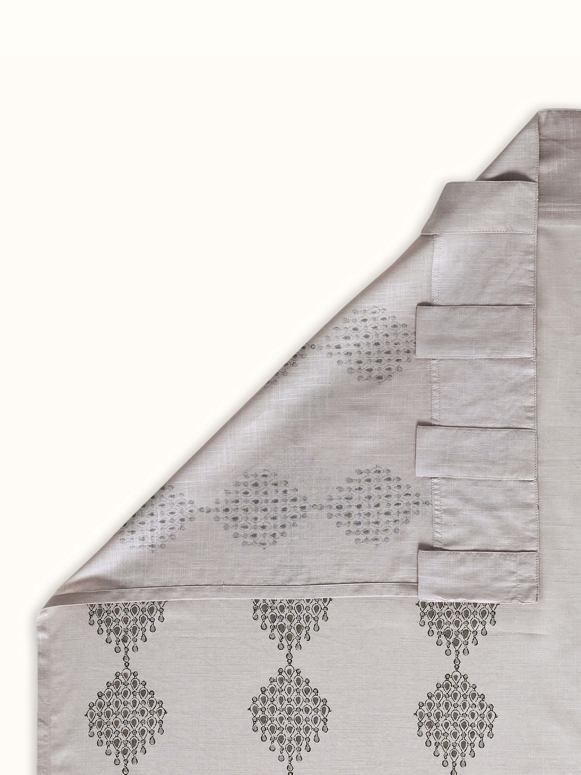 Back view of Rambagh light grey Sanganeri cotton curtain highlighting geo diamond pattern