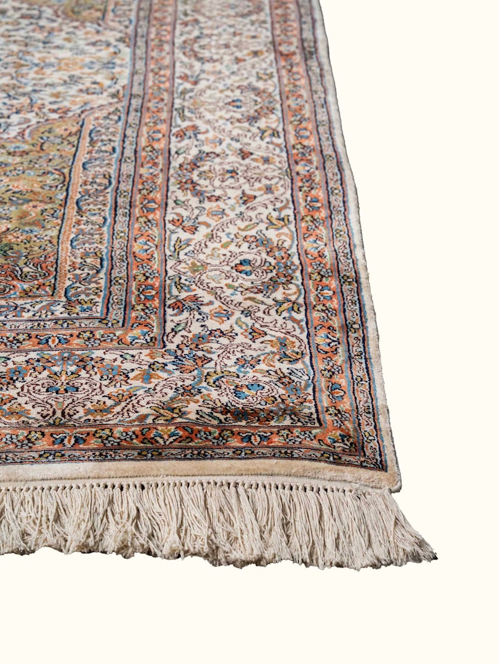 Close-up view of Traditional Persian Ivory Green Kerman Kashmir Silk Hand-Knotted Carpet highlighting the hand-knotted weave and motif detail