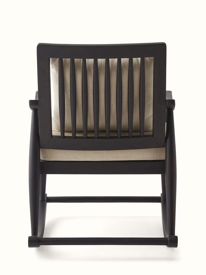 Rocking mechanism of the Sheesham wood and brass tarkashi chair, focusing on the smooth and sturdy construction for comfortable use.