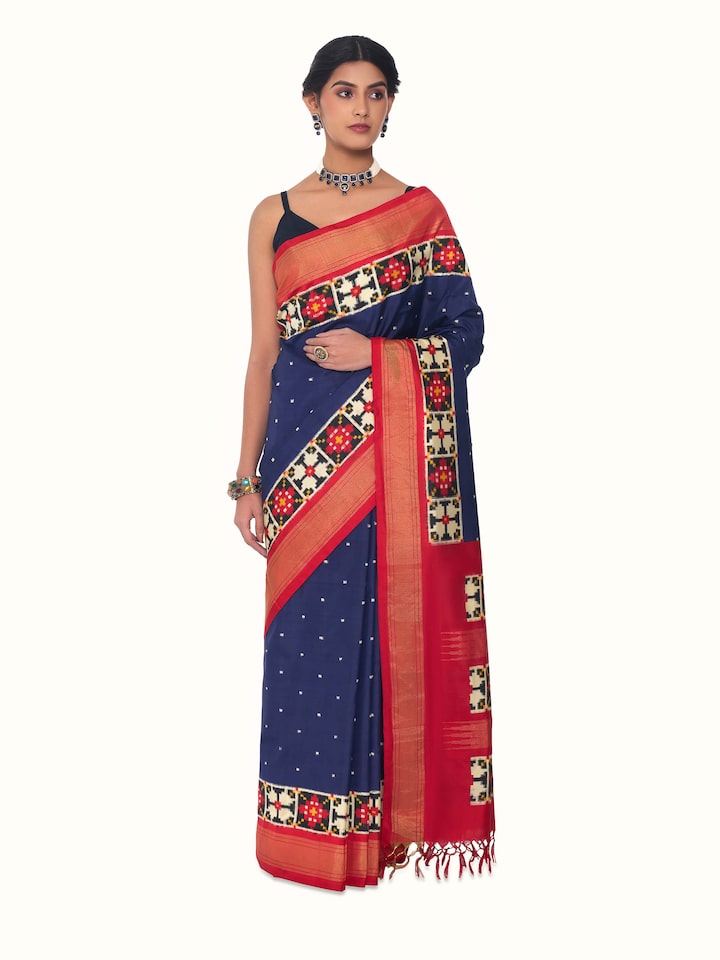 Front view of blue silk Pochampally double ikat saree showcasing geometric patterns