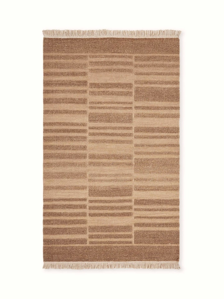 Front view showcasing the geometric multi-textured design in warm brown tones on the Bhadohi wool rug