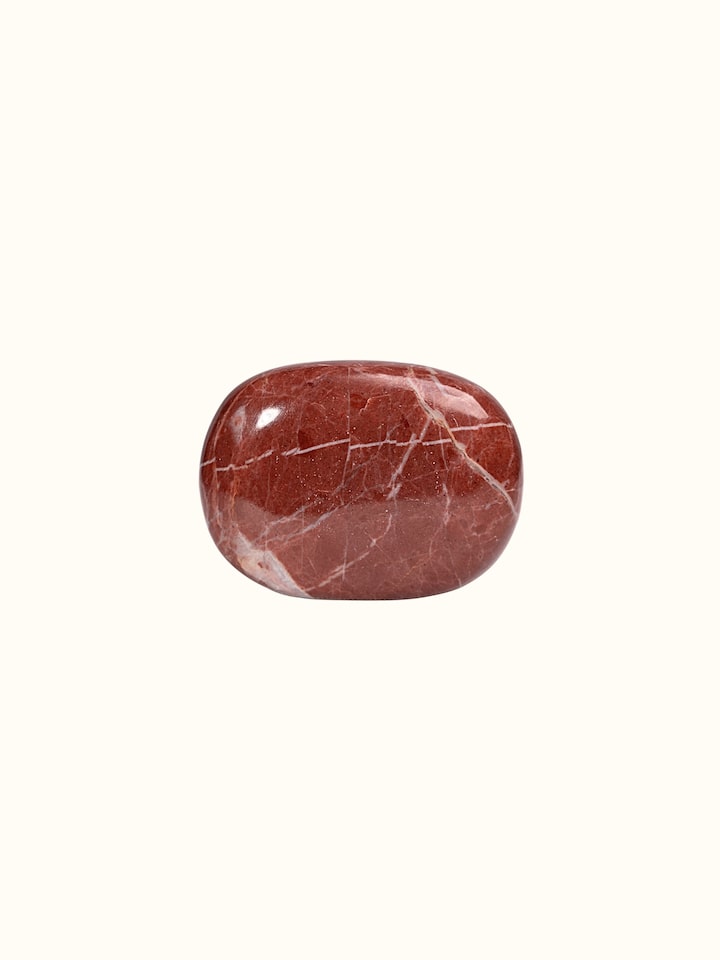 Lifestyle view of the Gemstone Red Jasper Palm Healing Stone