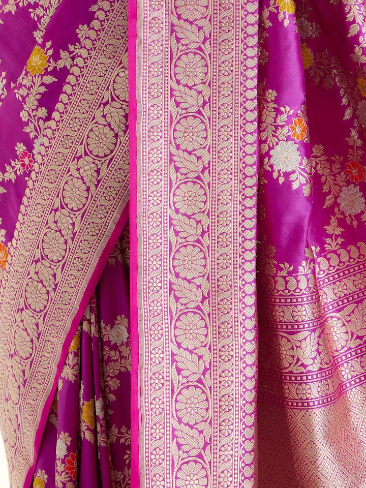 Detail view of magenta Banarasi silk kadwa jaal saree showing silk texture and zari craftsmanship