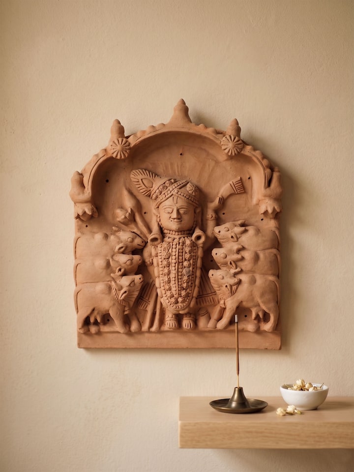 Side view of the Terracotta Clay Shreenath Ji with Cows Idol