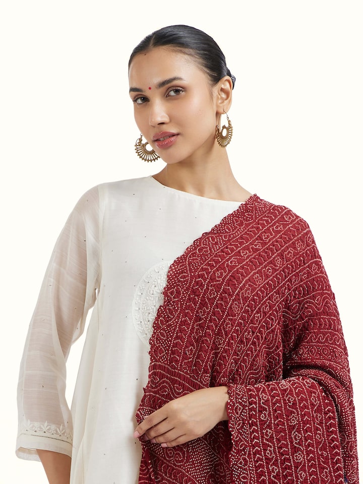 Angled view of Red Bandhani Tie & Dye Dupatta II revealing the depth of its color and intricate pattern